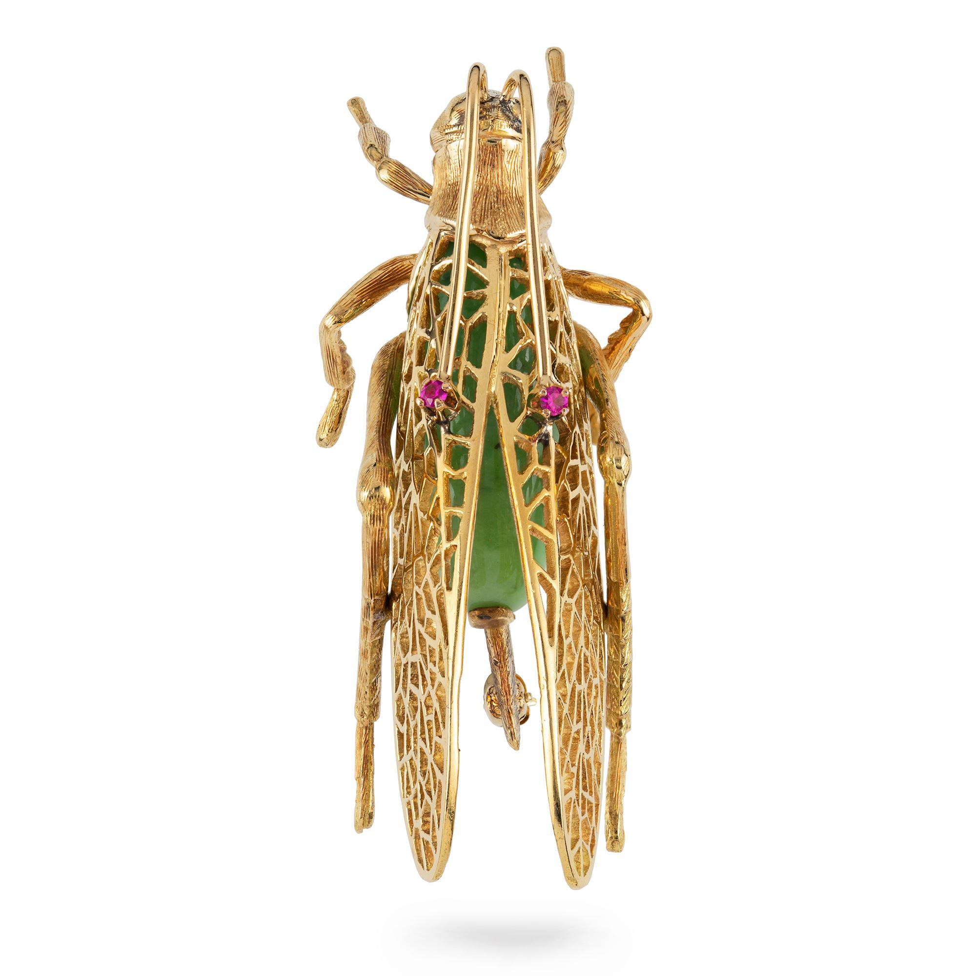 A gold and green grossular garnet grasshopper brooch, the body set with a green cabochon garnet, accompanied by GCS Report 79209-53 stating to be grossular-hibschite garnet weighing approximately 16.5 carats, the eyes set with faceted rubies, all to