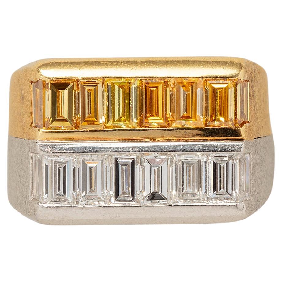 A Gold and Platinum Ring set with White and Fancy Yellow Baguette Cut Diamonds For Sale