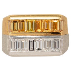 A Gold and Platinum Ring set with White and Fancy Yellow Baguette Cut Diamonds