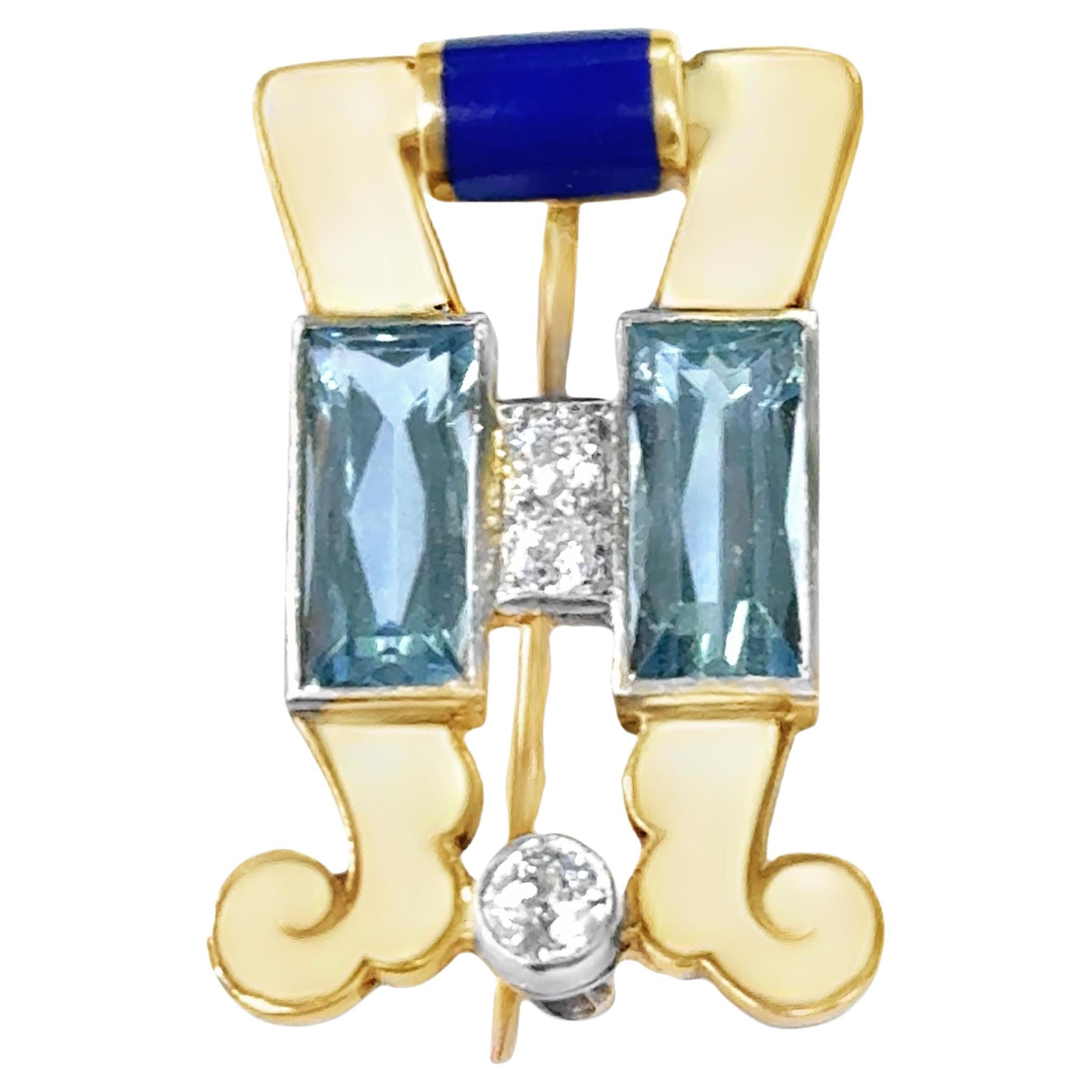 A gold and white and blue enamel brooch set with diamonds and aquamarine.