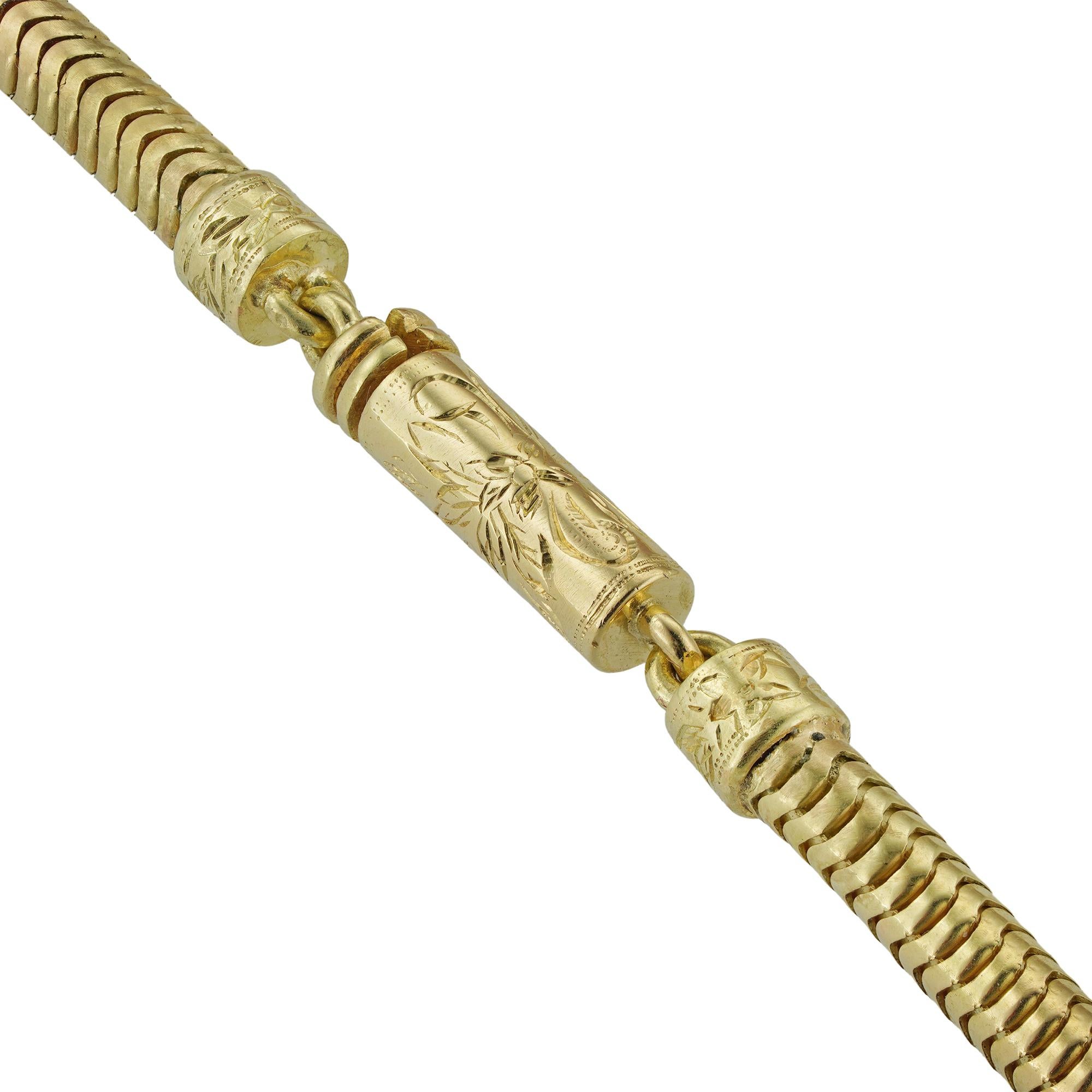 A gold Brazilian snake chain with an engraved barrel clasp, measuring approximately 110 cm (43.5 inches) in length, hallmarked 18 carat gold, London 2004, bearing Bentley & Skinner sponsor mark, gross weight 61.2 grams. 

This chain is in perfect
