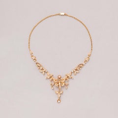 A Gold Butterfly Necklace with Old Cut Diamonds