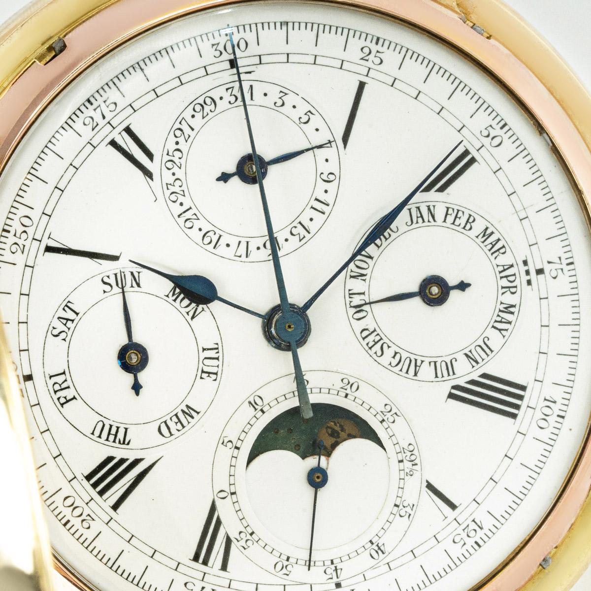 An 18k Yellow Gold Half Hunter Chronograph Calendar Minute Repeater Keyless Lever Pocket Watch

Dial: A white enamel dial with roman numerals and outer minute railtrack, with day and month subdial at 3 & 9 o'clock, moon phase, small seconds subdial.