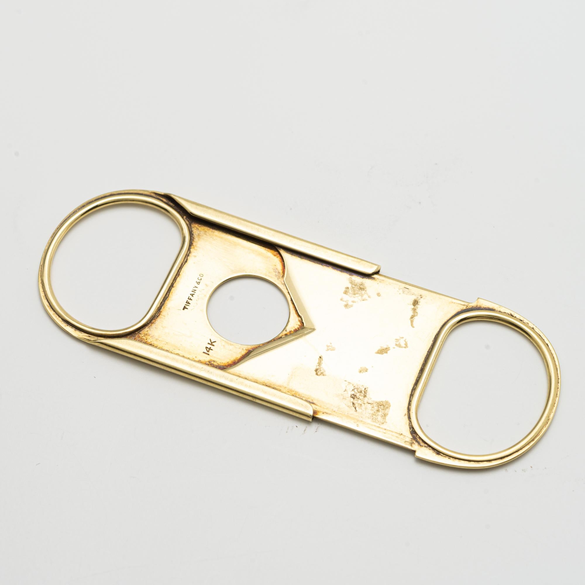 A Gold Cigar Cutter, by Tiffany & Co.
signed Tiffany & Co.
20TH CENTURY
Length 2 in. (5.08cm.) by Width 3/4 in. (1.9cm.)

