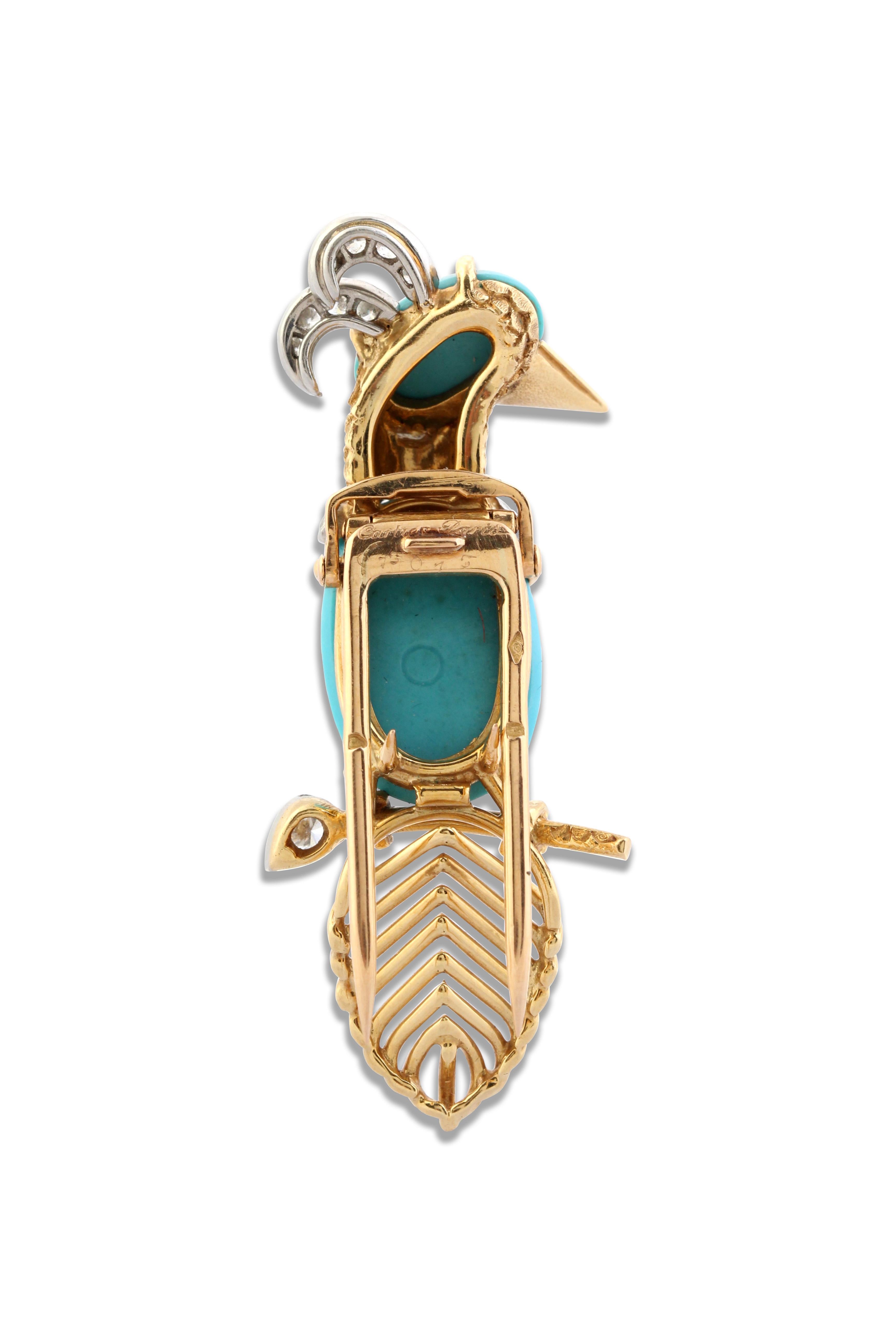 A Gold, Diamond and Turquoise Woodpecker Brooch by Cartier
A yellow gold, diamond and turquoise woodpecker bird brooch with additional platinum details. Total diamond weight =  0.40 carats. Length = 5 cm, Width = 2 cm. Signed and marked Cartier