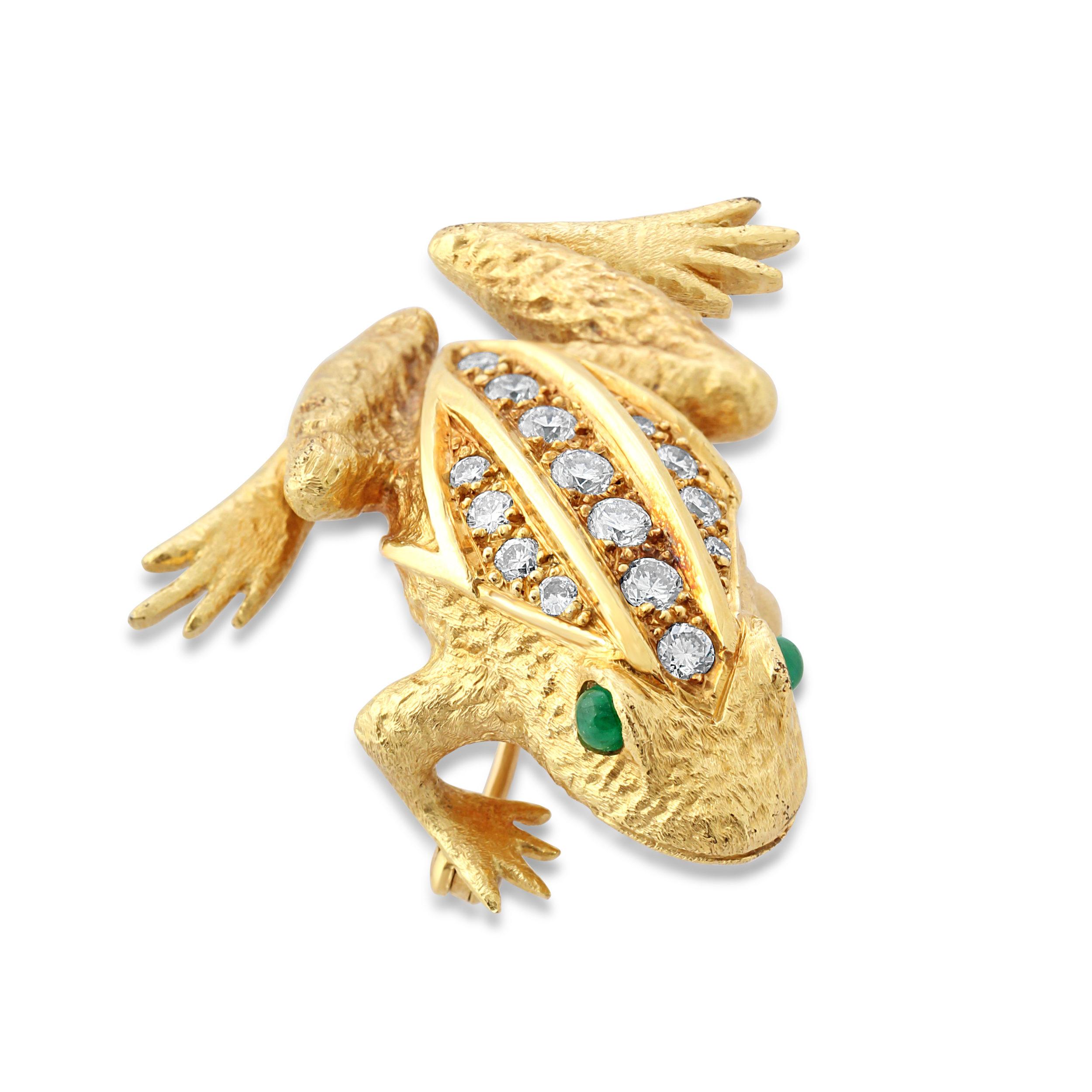 A gold, emerald and diamond frog brooch by E Wolfe & Co. A charming creature crafted from 18k yellow gold set with brilliant-cut diamonds along the back and emerald eyes. Total diamond weight = approximately 0.60 carats.