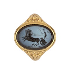 A Gold Finger-Ring Set with a Nicolo Intaglio of Eros Driving a ‘Biga’ Two-Horse