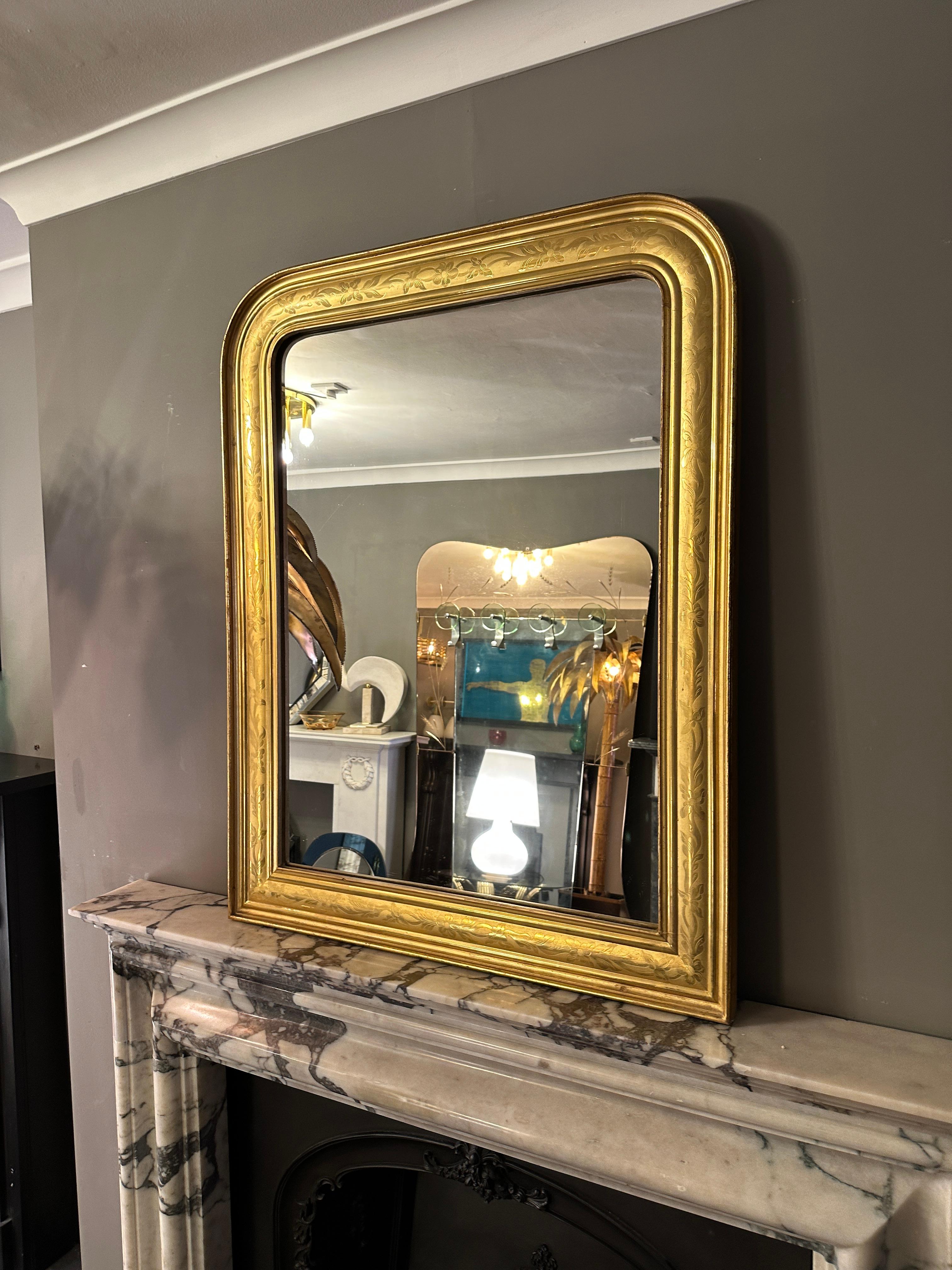 A very good quality French 22 carat gold leaf mirror by Auxerre Paris, usually made to order for galleries, churches and state offices etc. The gilt work with rich floral engraving. Original plate and back boards. 