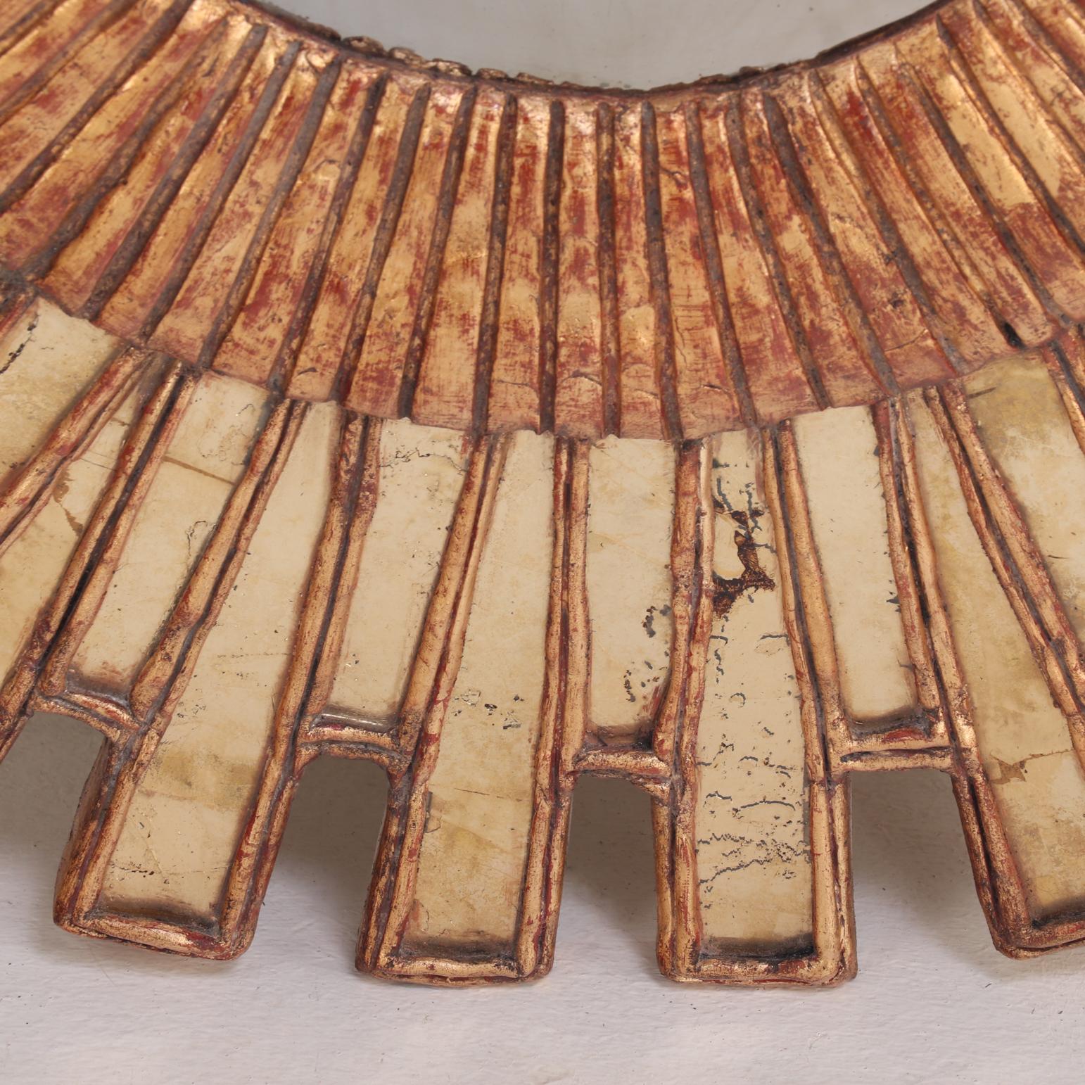 Contemporary A Gold Glass and Resin Sunburst Mirror. For Sale