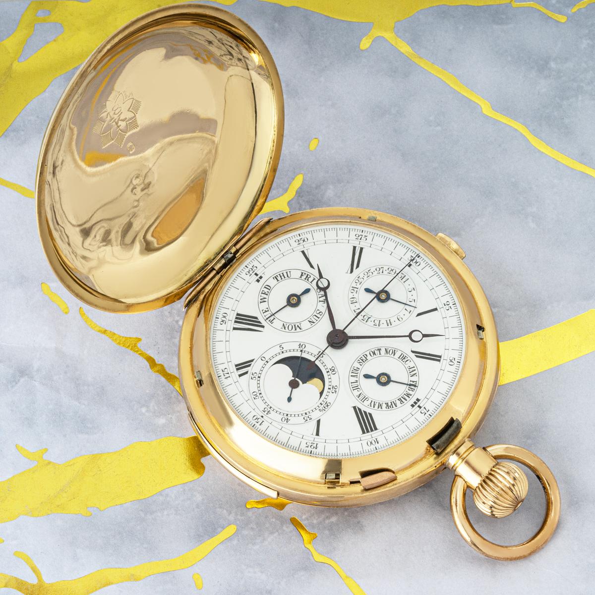 A Swiss Gold Keyless Lever Minute Repeater Calendar Chronograph Hunter Pocket Watch C1890s

Dial: The white enamel dial with Roman numerals outer minute track and tachymetric track. The subdials for the date at twelve o'clock, day at nine o'clock,