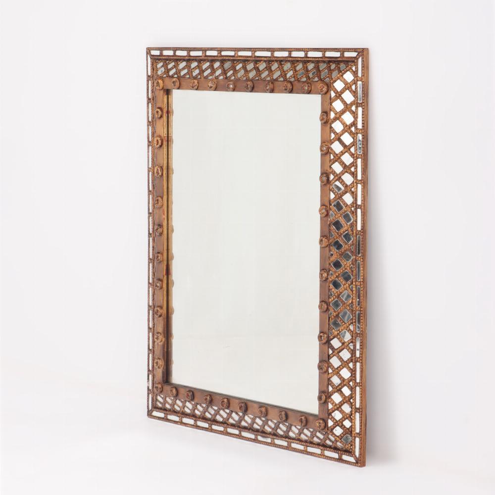 Great size! This mirror has a wood frame with a lattice design done in a gold finish around 1950. The central mirror is framed by smaller pieces of mirror.