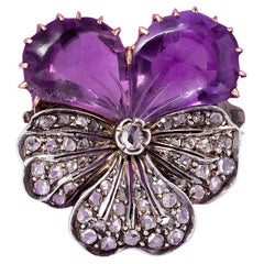 A gold pansy brooch amethyst and diamond