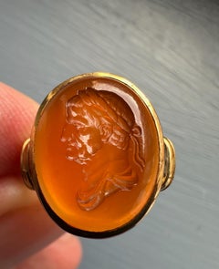 A gold ring set with a 18th century carnelian intaglio. Bust of Emperor Galba.
