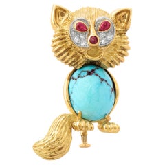 A Gold, Turquoise & Diamond Cat Brooch by Cartier