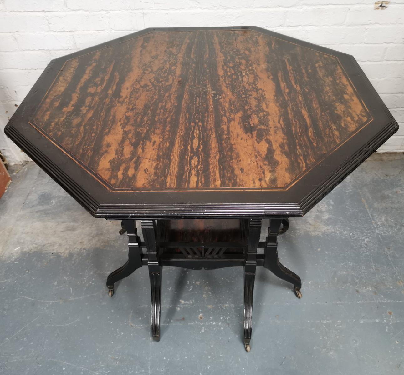 English Lambs of Manchester An Aesthetic Movement ebonized Walnut eight leg centre table For Sale