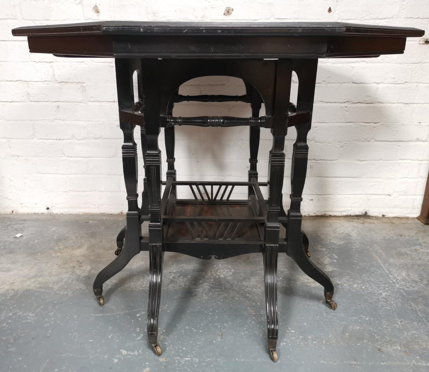 Late 19th Century Lambs of Manchester An Aesthetic Movement ebonized Walnut eight leg centre table For Sale