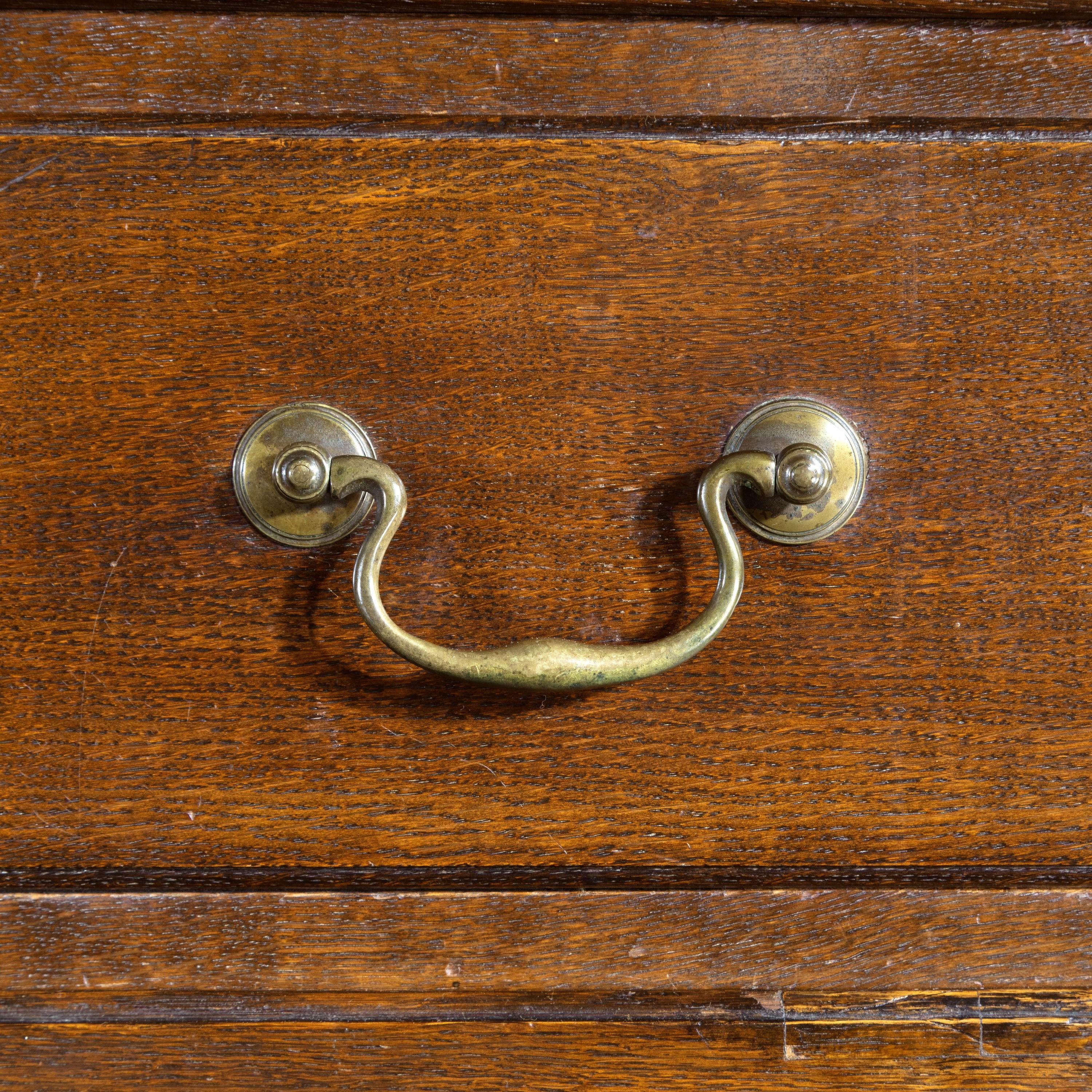 A good and original George III period oak chest on chest. On high swept, original, shaped bracket feet and with very good swan necked handles, all original to the chest. Good medium rich color.
    