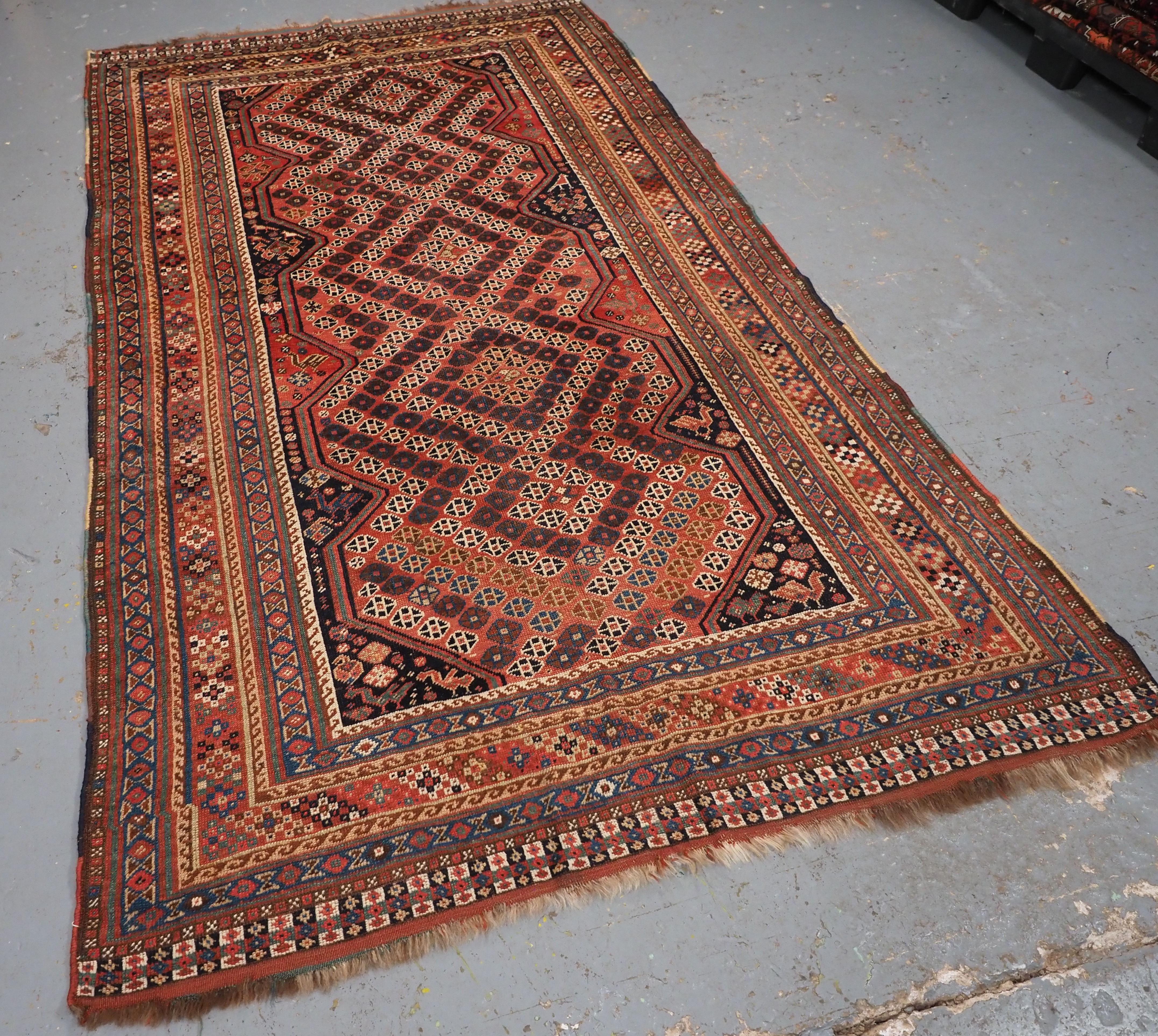 Size: 7ft 11in x 4ft 7in (242 x 140cm).

A good Antique Tribal Qashqai rug with diamond lattice design.

Circa 1880.

An interesting rug with one of the less common Qashqai designs, small diamonds forming a lattice giving the rug a sense of
