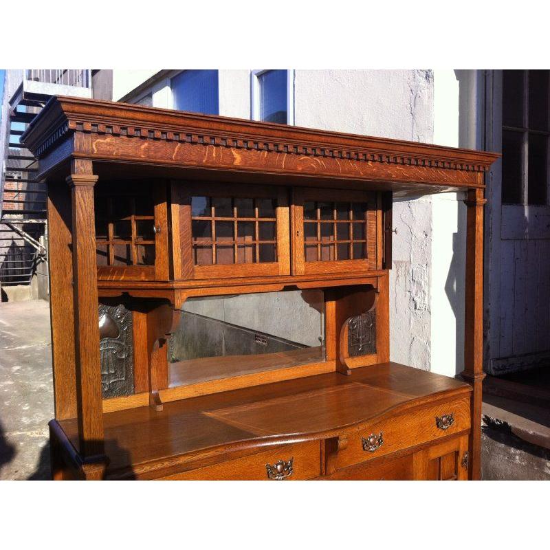 Arts and Crafts Liberty & Co attr Arts & Crafts oak sideboard with Stylized Copper Floral Panels For Sale