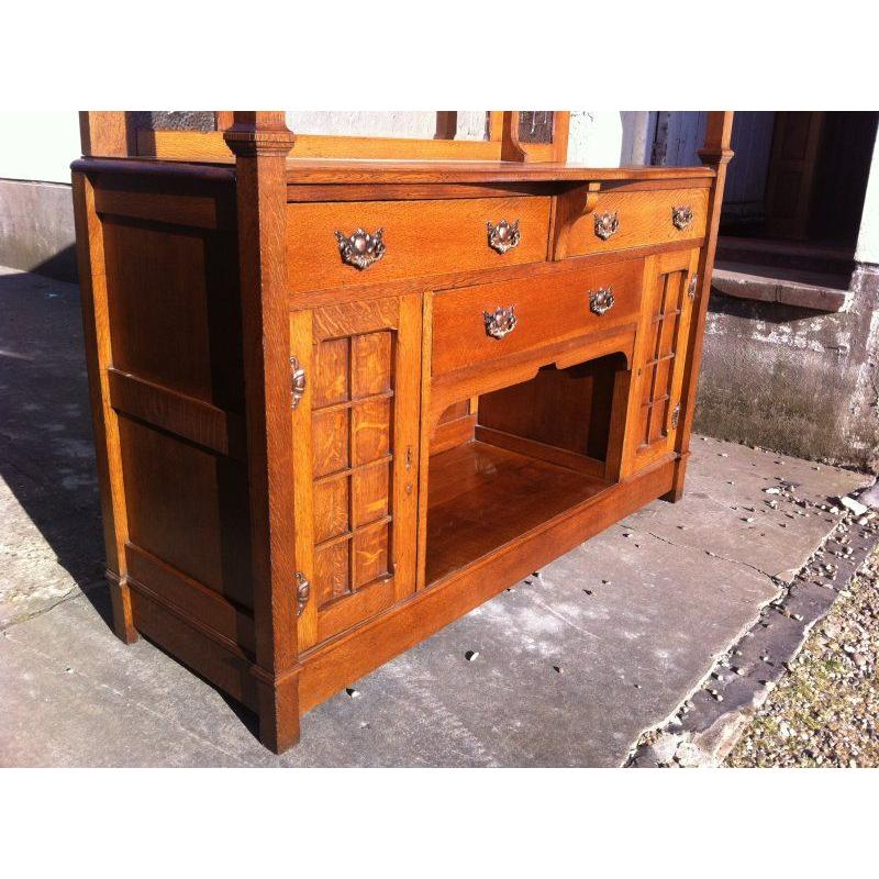 Oak Liberty & Co attr Arts & Crafts oak sideboard with Stylized Copper Floral Panels For Sale