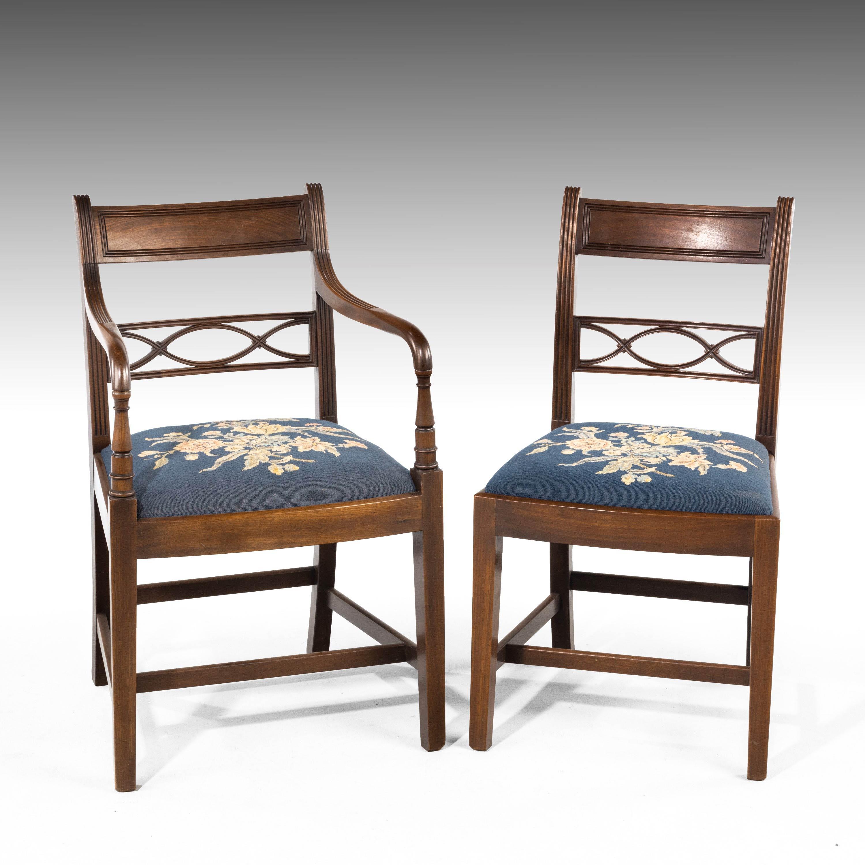 A very good set, (6+1) Whitehaven mahogany framed elbow chairs. With finely drawn and carved centre sections to the back splats. Tapering square supports. Covered in a fine Lee's tapestry.
 