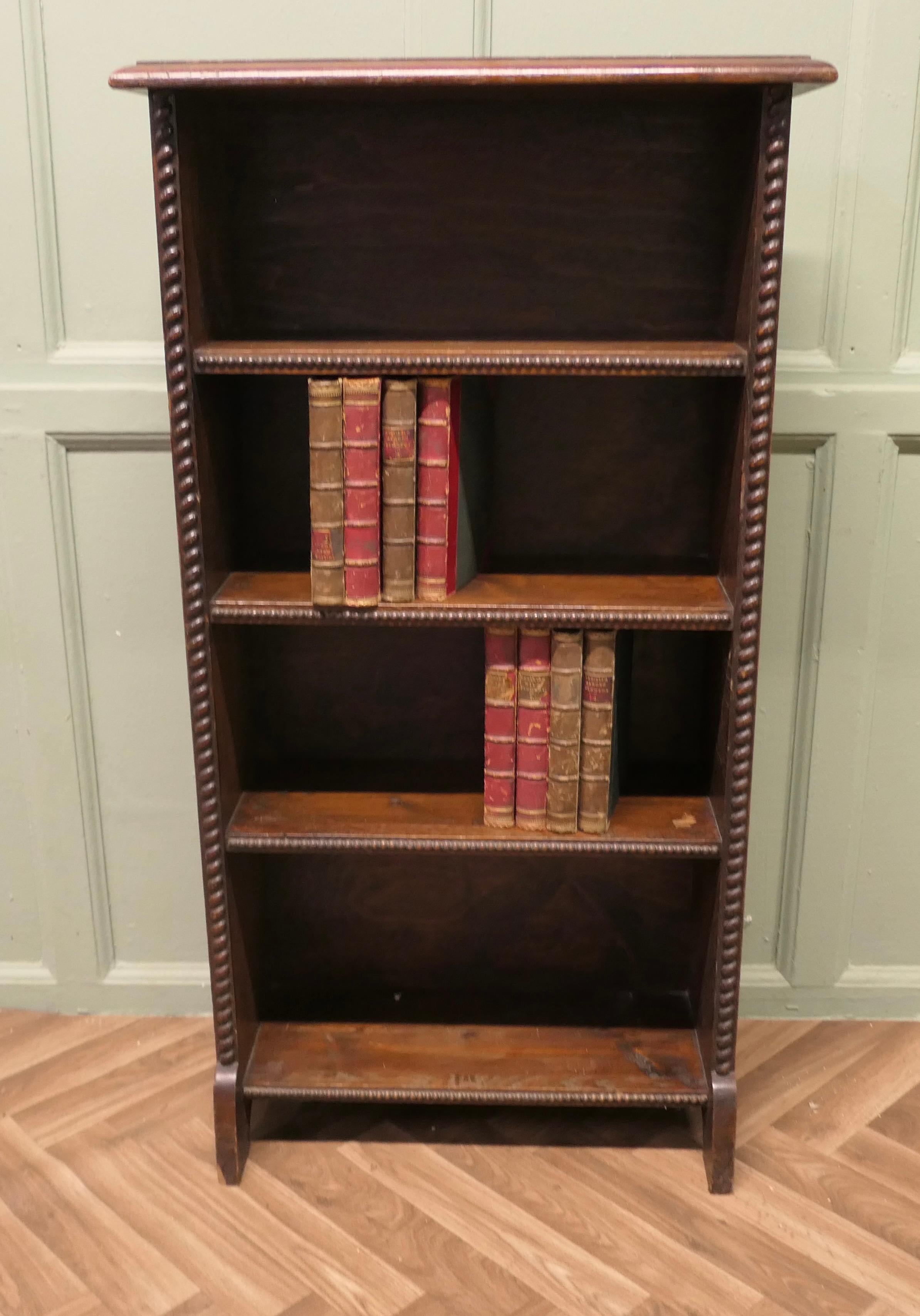 A Good Early 20th Century Open Oak Bookcase

This is an attractive piece, the book case has 4 shelves and has a carved moulding to the front, all in all a very good architectural piece which will blend in or stand alone
The Book shelf is in very