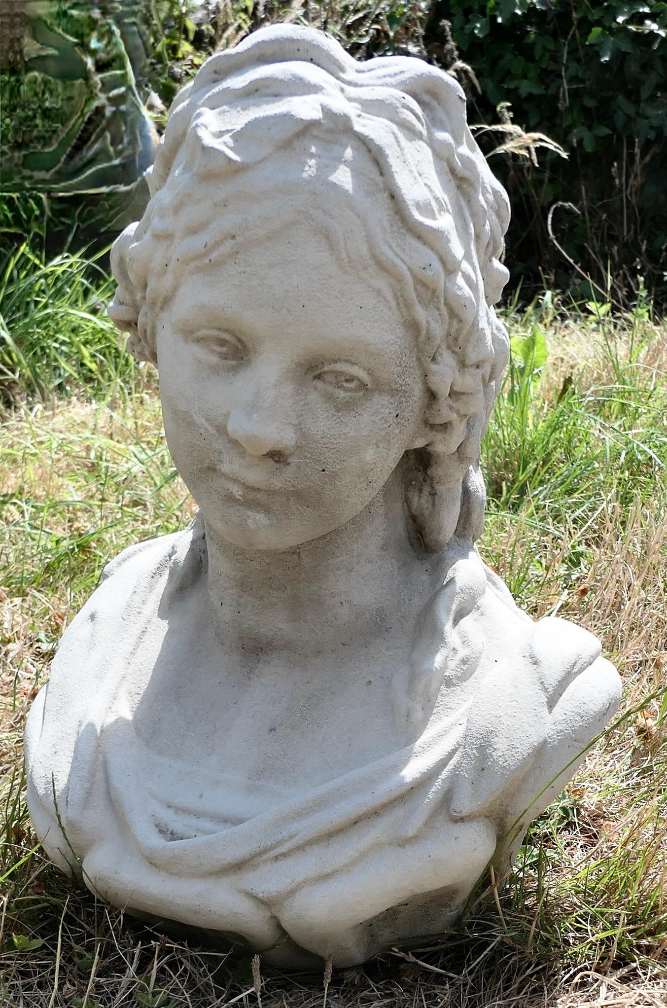 A Good Large Bust of a Regency Lady

A Good Large Bust of a Regency Lady, this is a good quality bust, it is made in a stone compound and has a slightly weathered patina 
This is an elegant likeness of a character from the early 19th Century