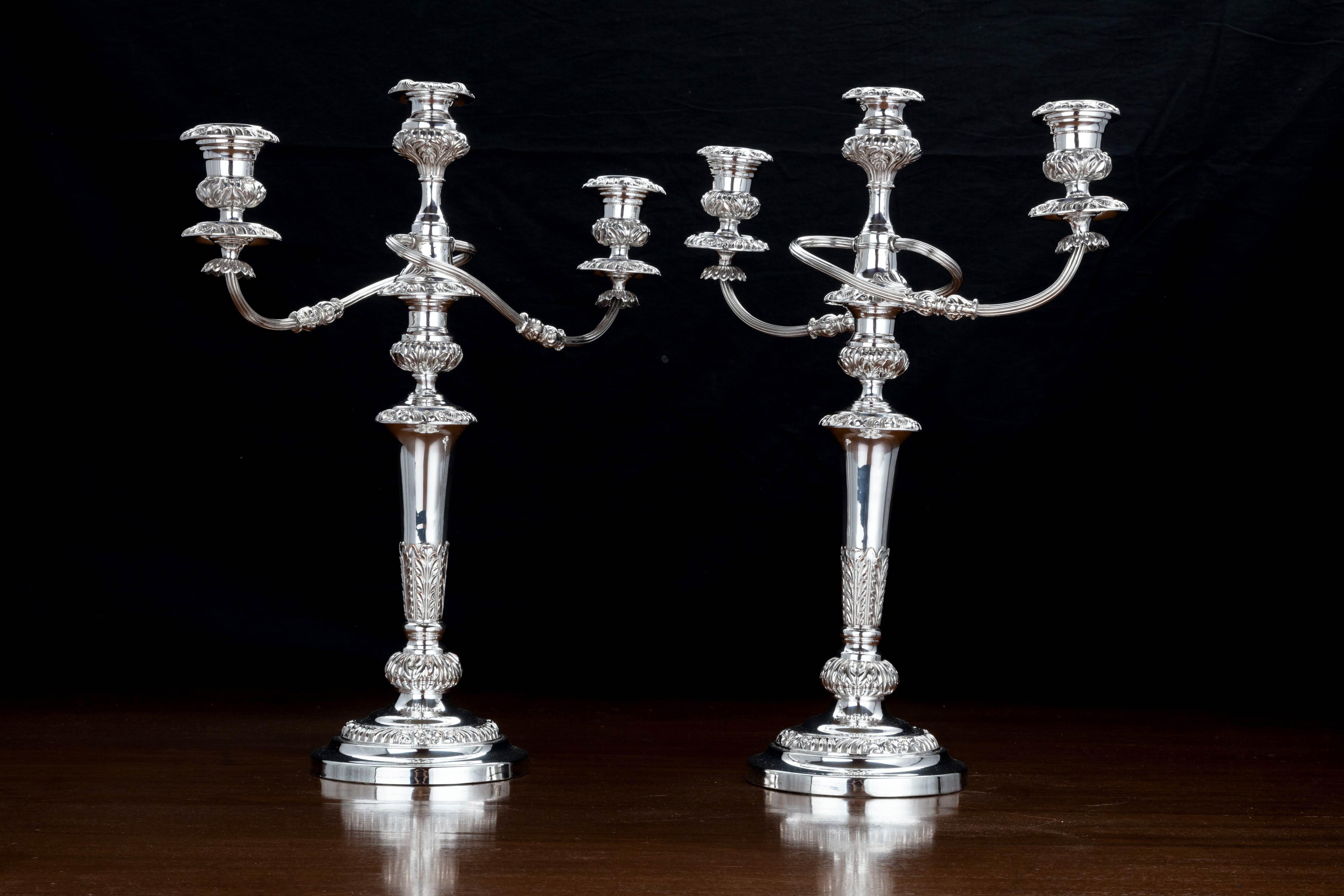 A good pair of Sheffield-plated, three-arm candelabra in excellent original condition. Very well cast details. The arms swept. Can be used as a pair of candlesticks or candelabra.