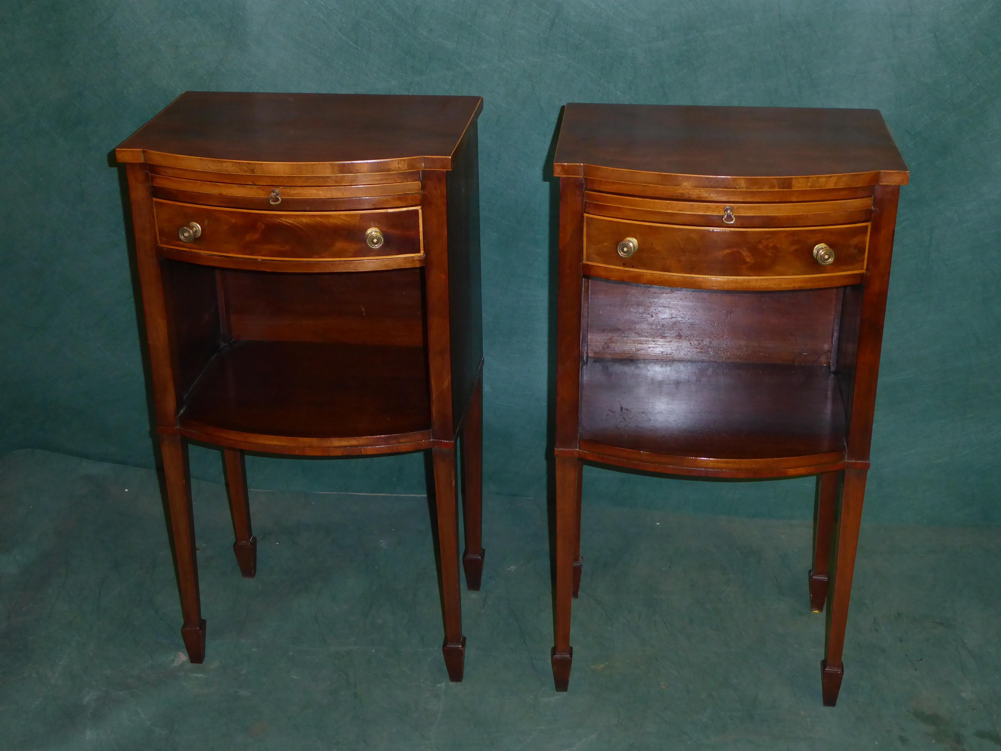 A good pair of bow front Edwardian bedside cabinets in mahogany with one-drawer on extending shelf and open space below raised on square tapered legs.