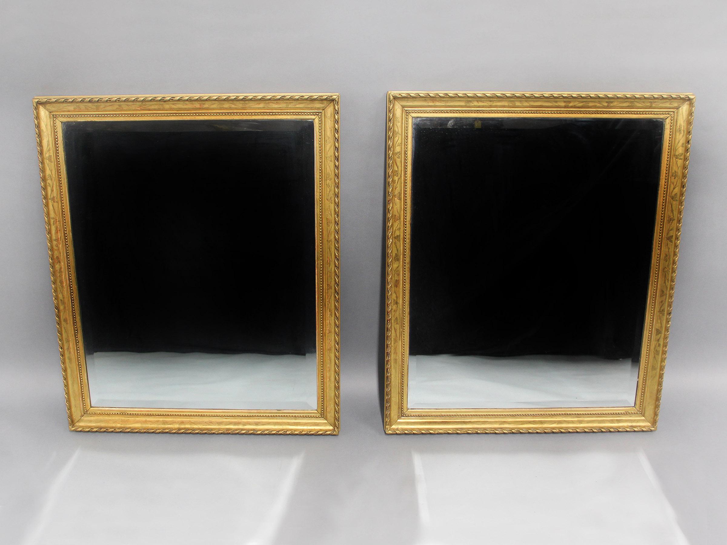 A Good Pair of Late 19th Century Carved Giltwood and Gesso Mirrors

The rectangular frames with very nicely etched floral and foliage designs within a spiral rope boarder, beveled mirrors.

Details:
Height – 36 inches / 91cm
Width – 30 inches / 76cm