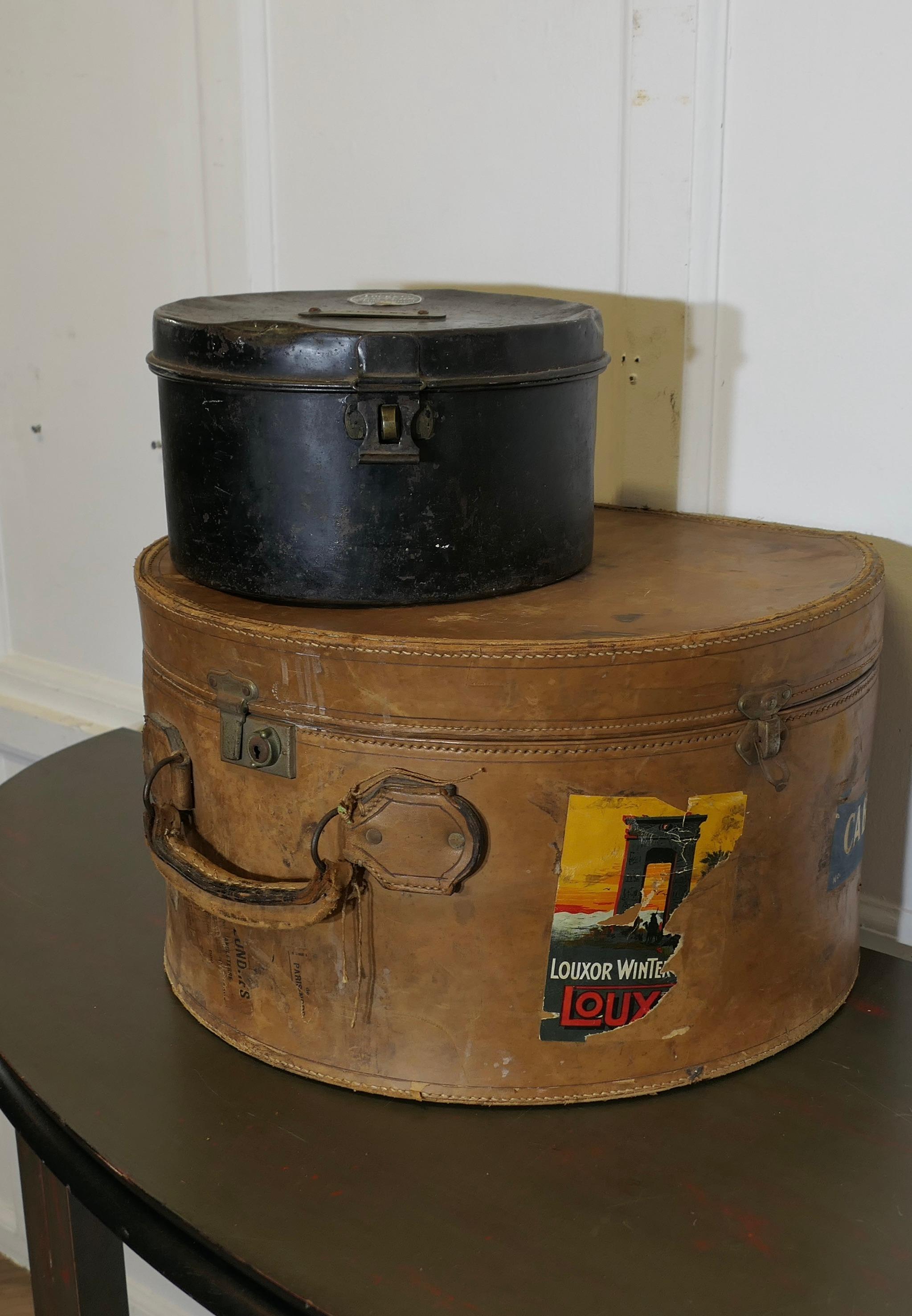A Good Quality 19th Century Leather Hat Box and One Metal

This is a sturdy piece it is made from very stiff leather and protects it contents well, the case has a flat studded bottom with a hinged lid and it is beautifully lined in linen with