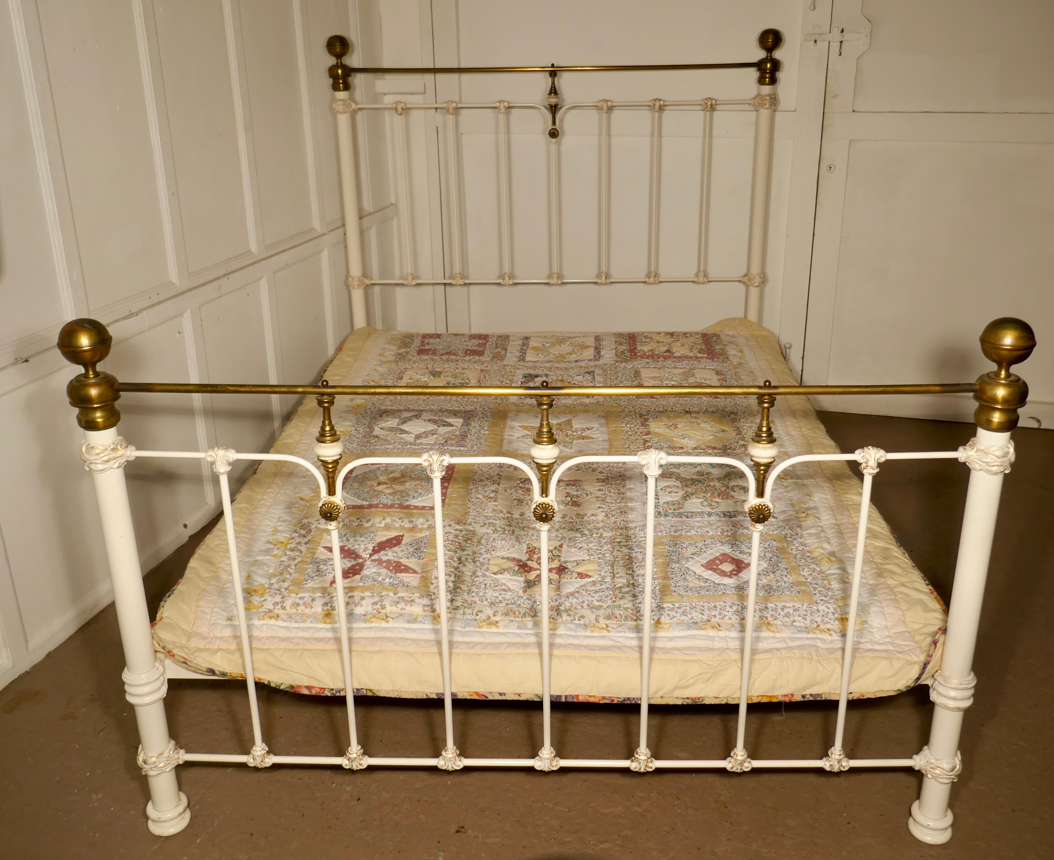 A good quality brass and iron king size 5ft wide bed

This is a mid-20th century brass and iron king size bed, it is in original white paint, somewhat darkened with age, with pretty gold detail
All in all a very attractive bed timeless in design