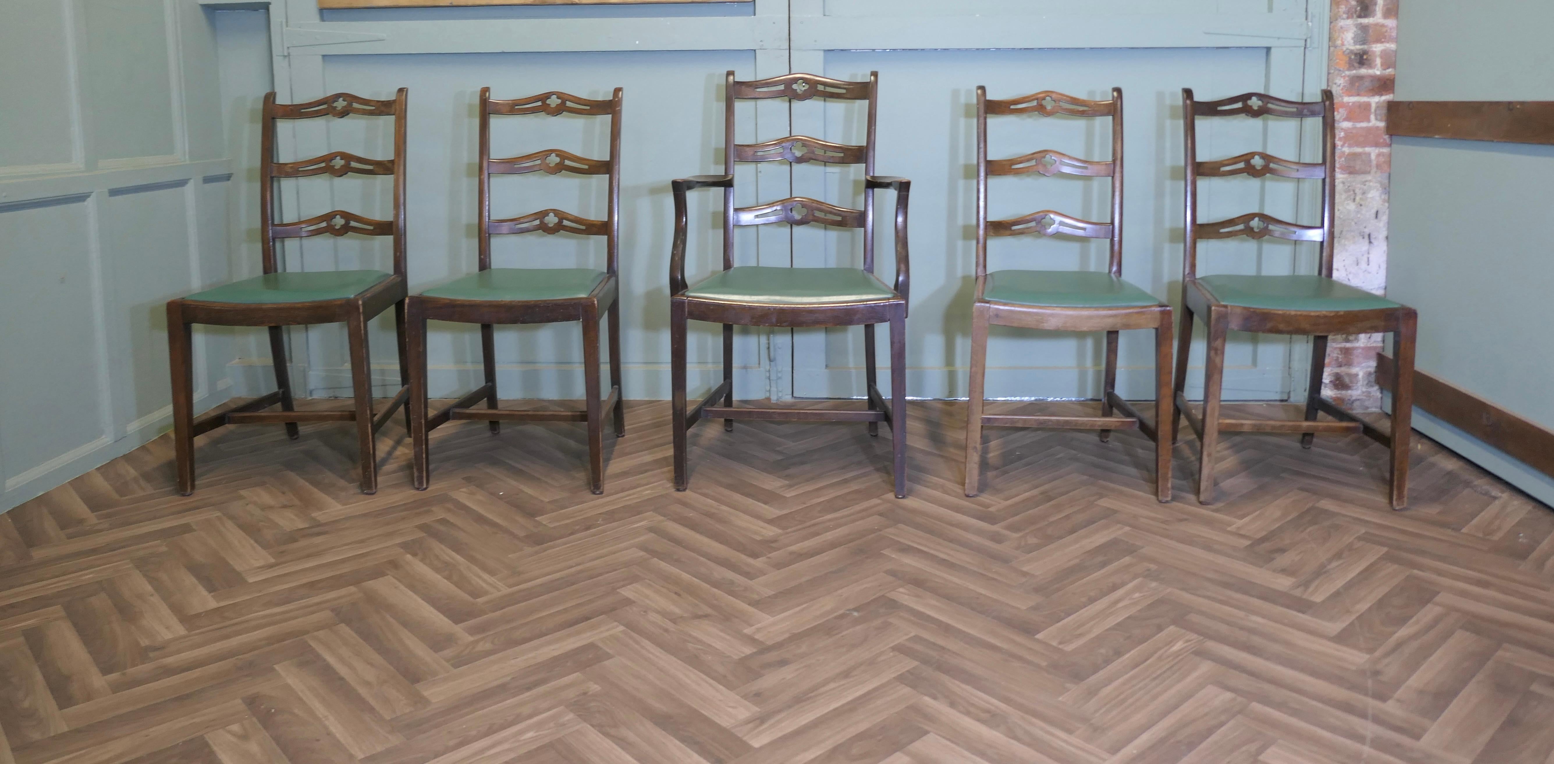 A Good Set of 5 Wavy Ladder Back Dining Chairs

This is a very attractive set of Dining chairs with a wavy ladder back, the set has 1 Carver and 4 single chairs, they are upholstered in green and they do have a delightful country look with only a