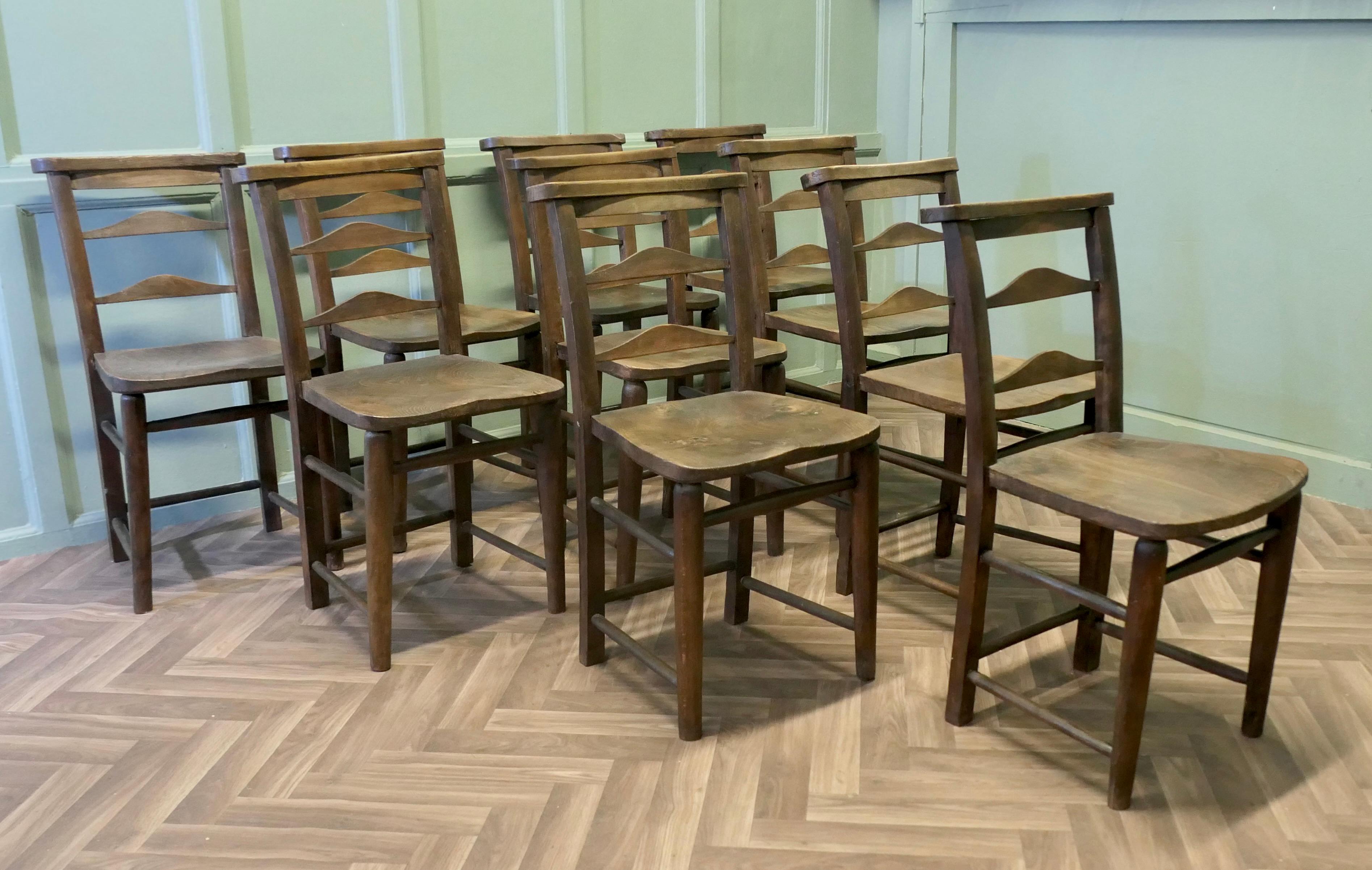 A Good sturdy set of 10 Victorian Chapel Chairs

The chairs have 1” thick solid elm seats nicely shaped for comfort with beech legs and stretchers, they have a broad top rail back rest 
This is a very sturdy set of chairs, they have a good patina