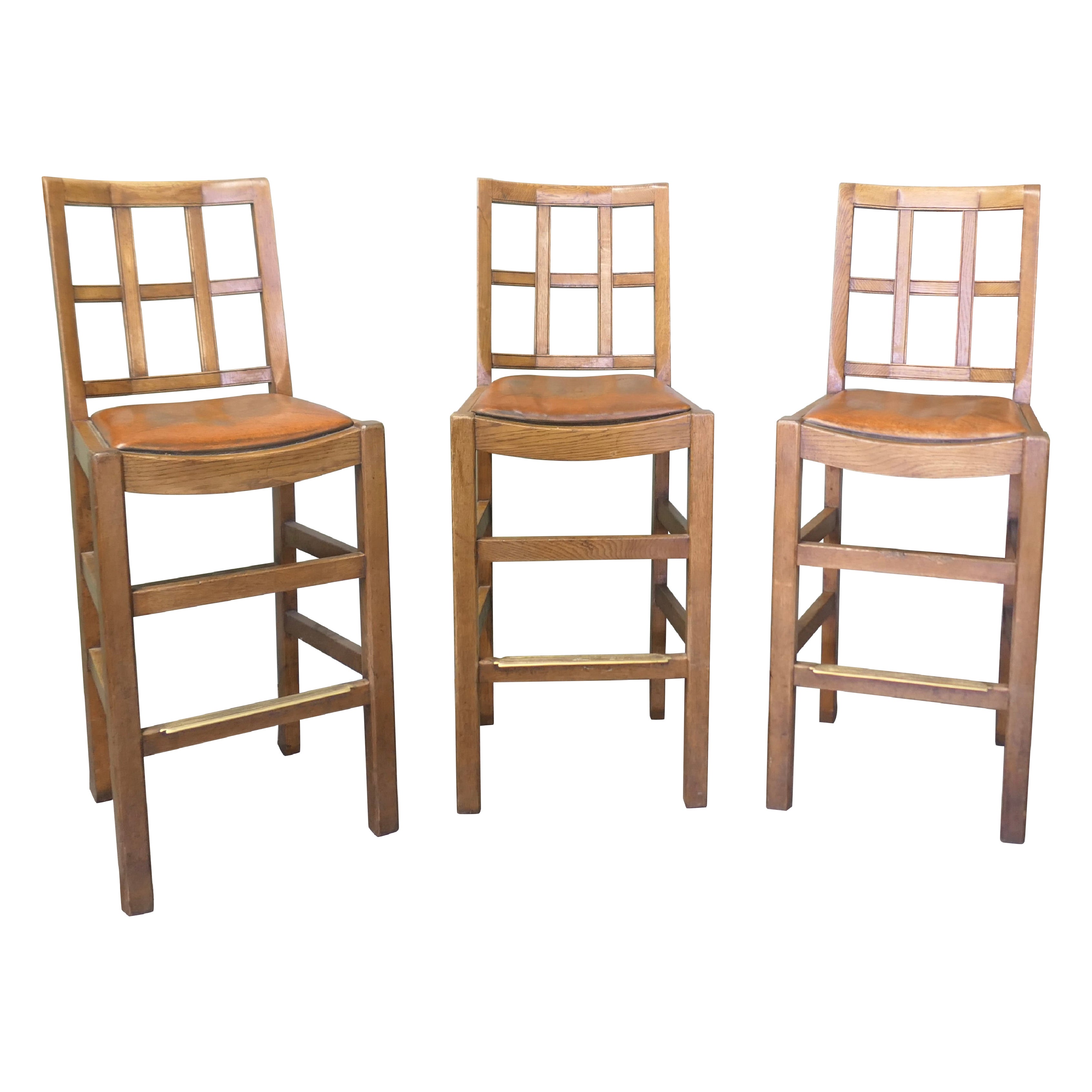 A Good Trio of Arts and Crafts High Bar Stools, in Leather and Golden Oak