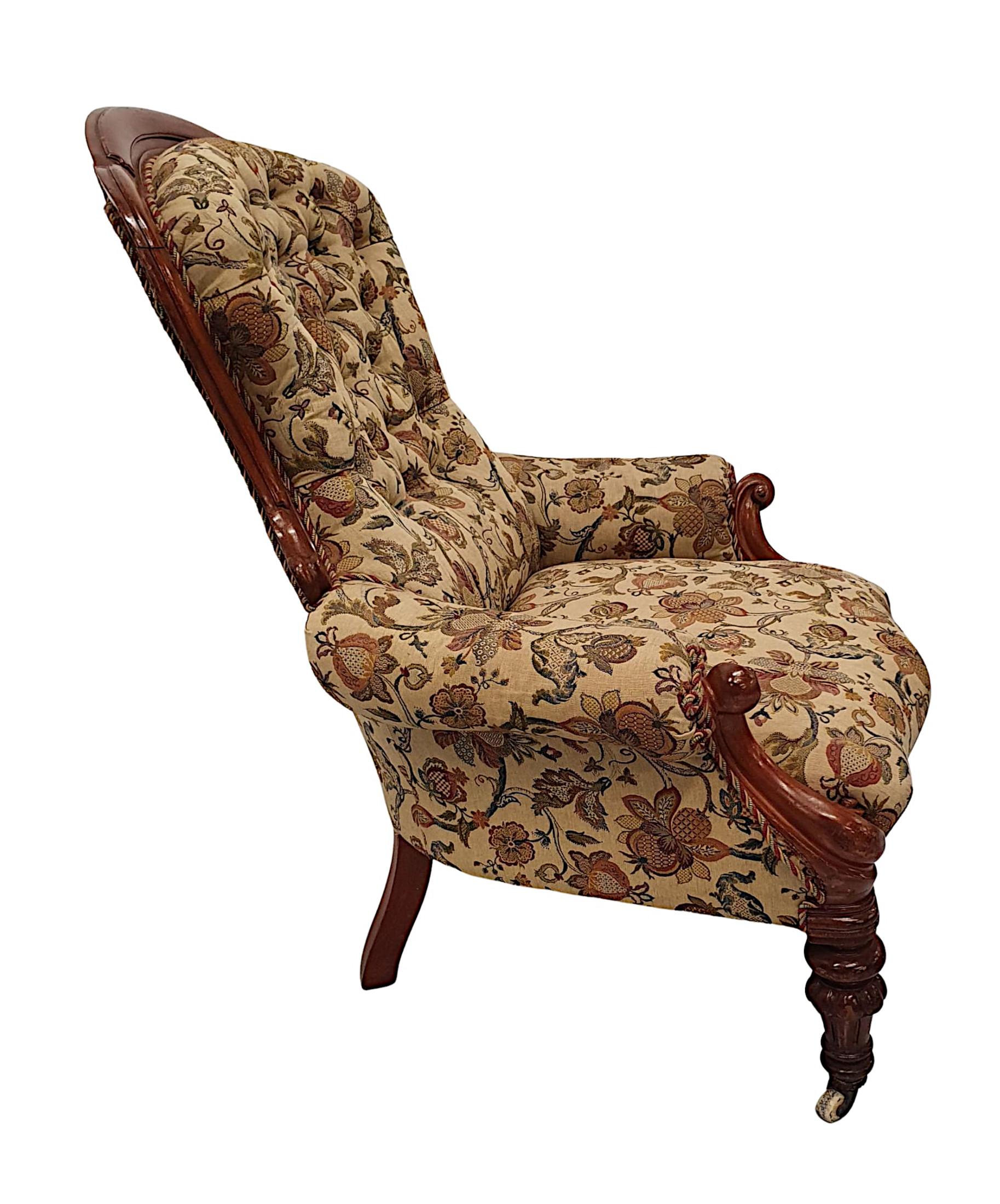 A gorgeous 19th Century mahogany button back armchair, fully restored and of fabulous quality. The curved back framed with beautifully hand carved mahogany scroll detail raised over out scrolling arms with stunning scroll supports raised over