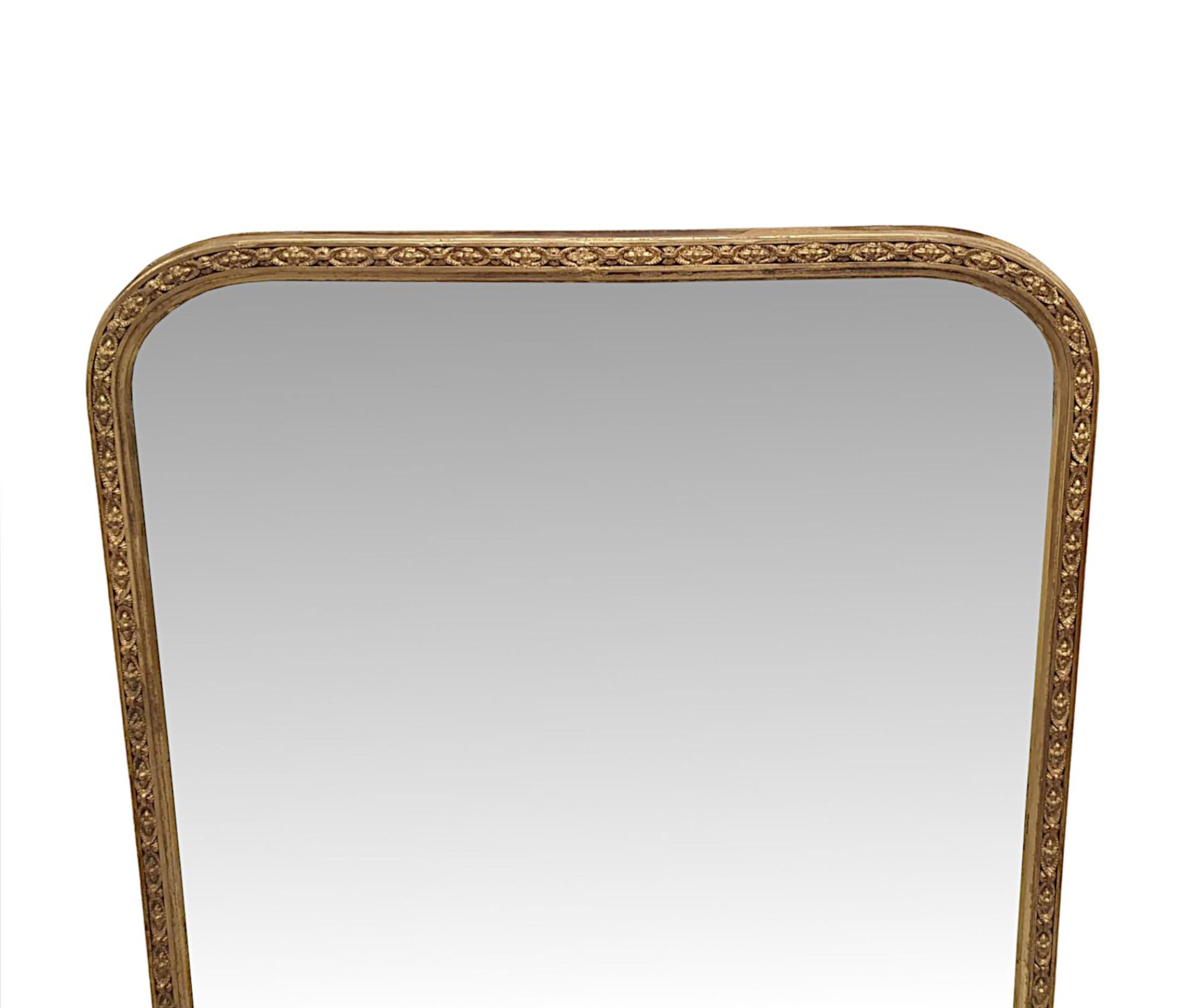 A gorgeous 19th Century giltwood overmantle mirror finely hand carved and of fabulous quality.  The original sparkly mercury mirror glass plate of rectangular form with curved detail to the top corner returns is set within a beautifully simple,
