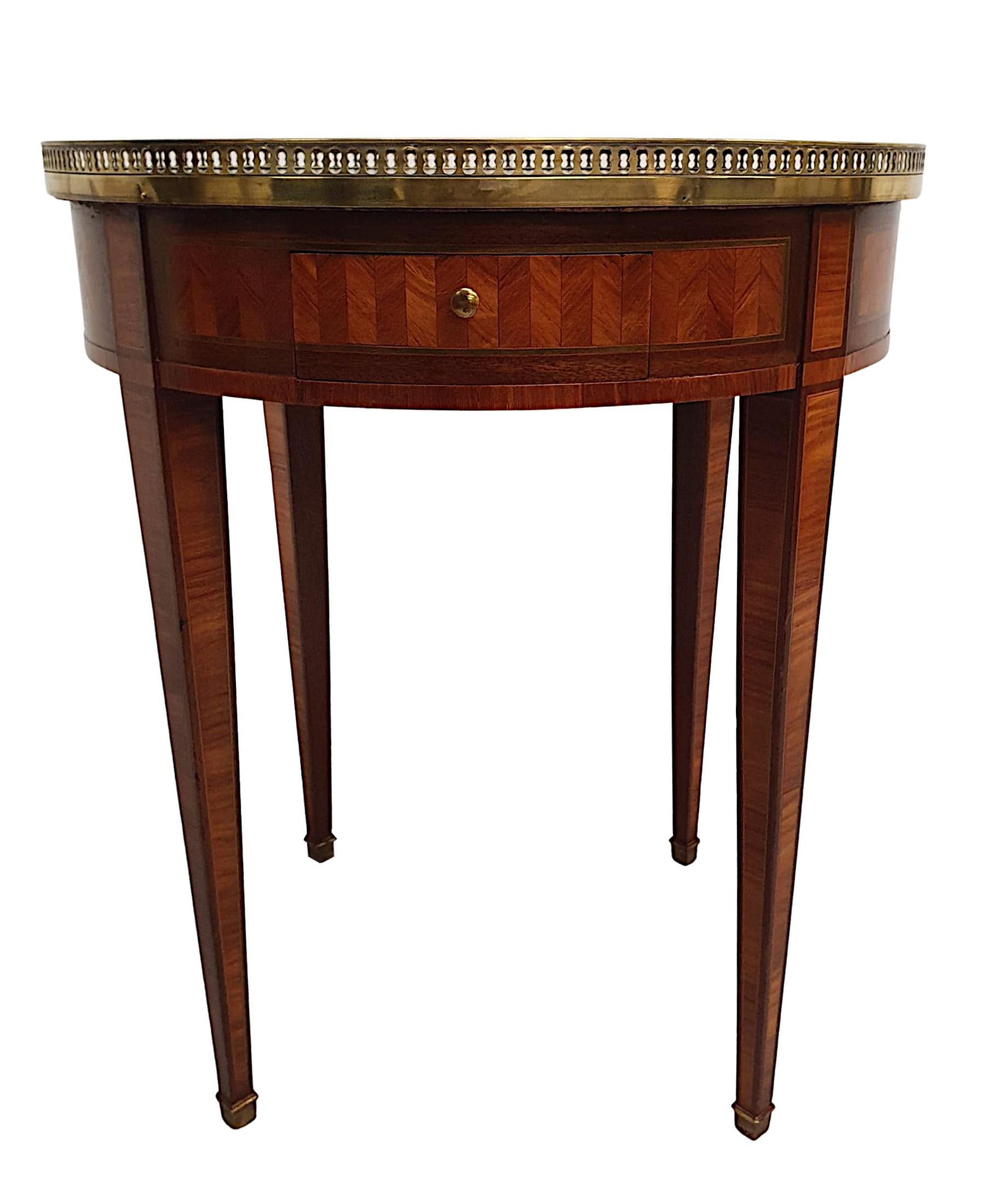 A gorgeous Edwardian centre table of exceptional quality, finely carved, crossbanded and line inlaid throughout with richly patinated timbers comprising of mahogany, tulipwood and walnut. The moulded top of circular form surmounted with decorative