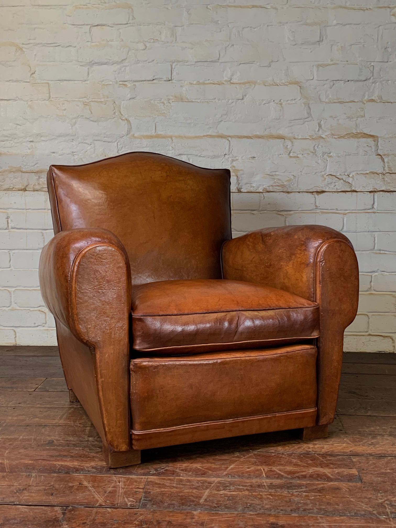 This lovely chair in warm caramel has aged beautifully. The all-original caramel leather has a pleasing patina, achieved through use and care. This is a solid chair with a notable weight, signifying its superior build quality and overall