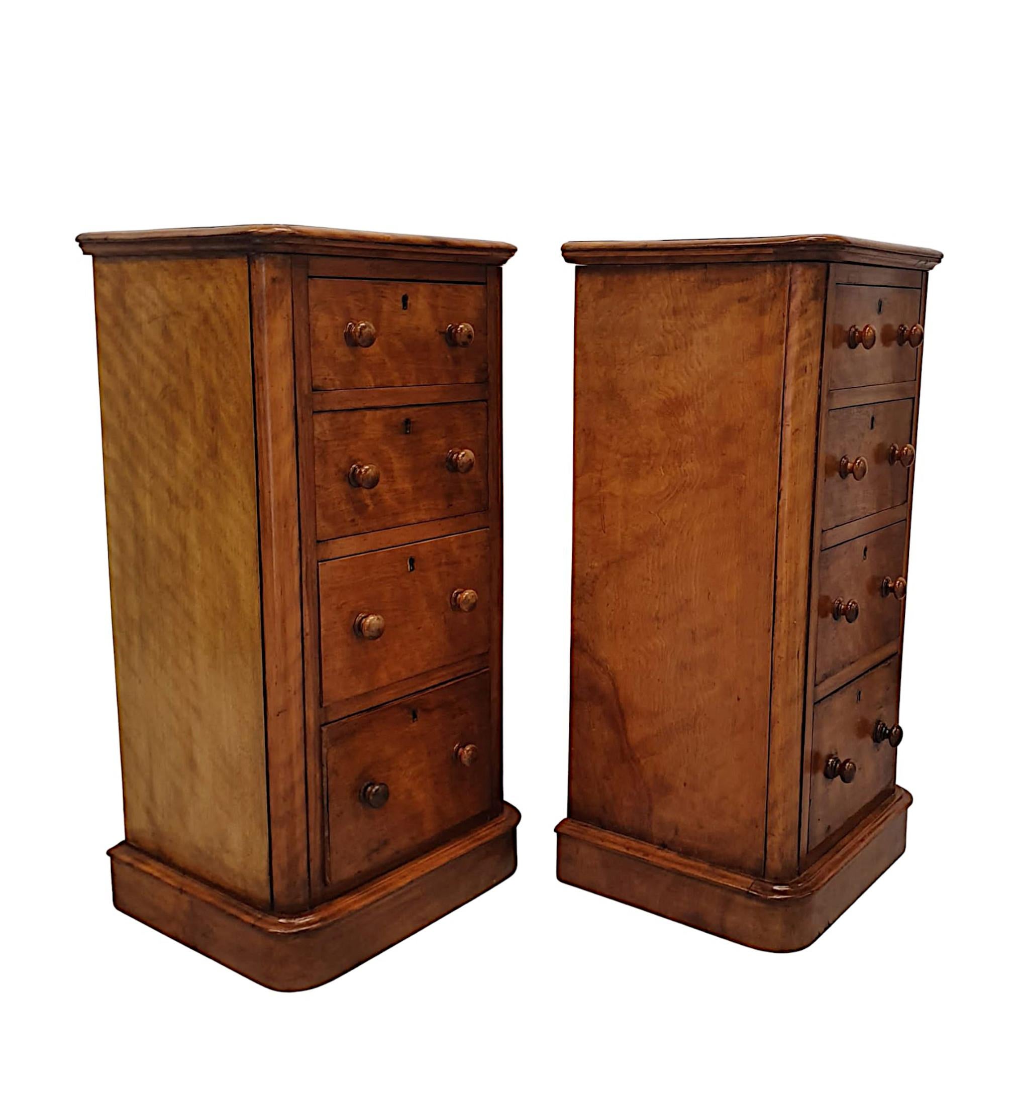 A gorgeous pair of 19th Century beautifully patinated satinwood bedside chests. The moulded top raised raised over four graduated drawers with turned pulls and brass escutcheons supported on moulded plinth base.