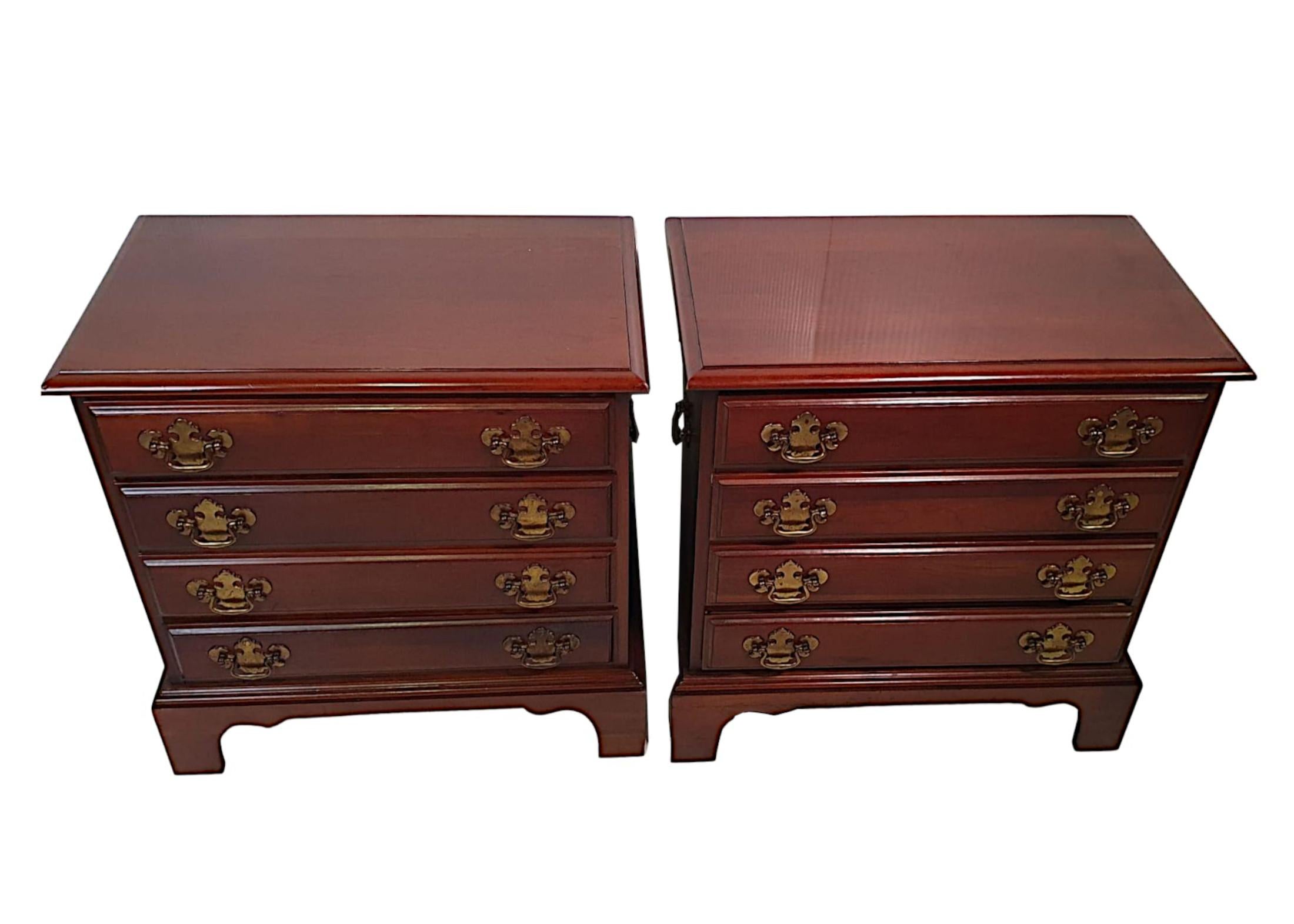 A gorgeous pair of 20th Century mahogany bedside chests in the Georgian manner. The moulded top raised above four long drawers with decorative brass swan neck ring pulls supported on finely carved ogee bracket feet.