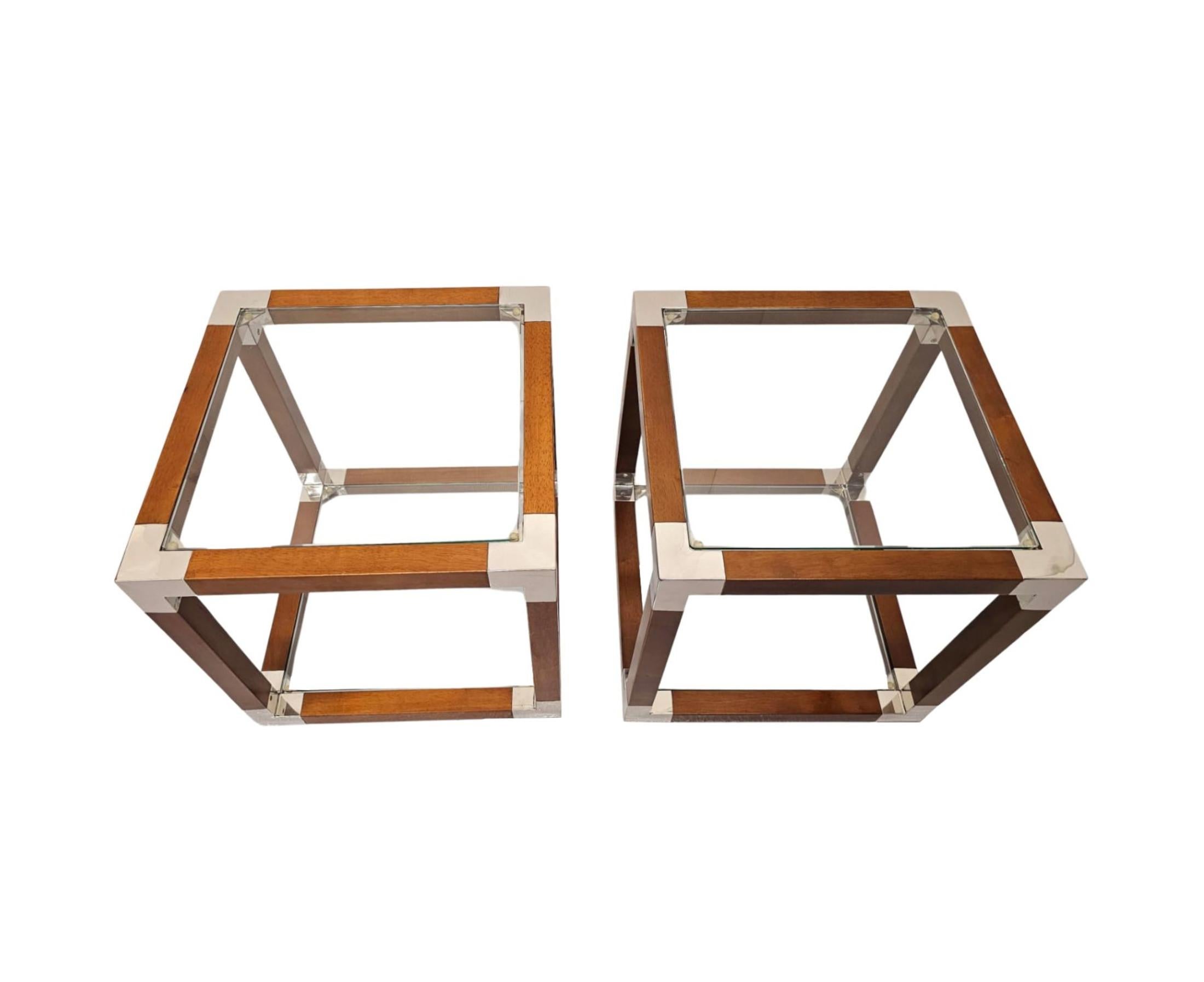 A gorgeous pair of glass, cherrywood and chrome side tables of exceptional quality and square form with a strikingly clean simple design.  The glazed top and lower shelf are set within a fabulous, finely carved, richly patinated and well figured