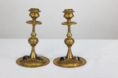 Gothic Revival brass desk set with a pair of candlesticks & a matching pen tray.