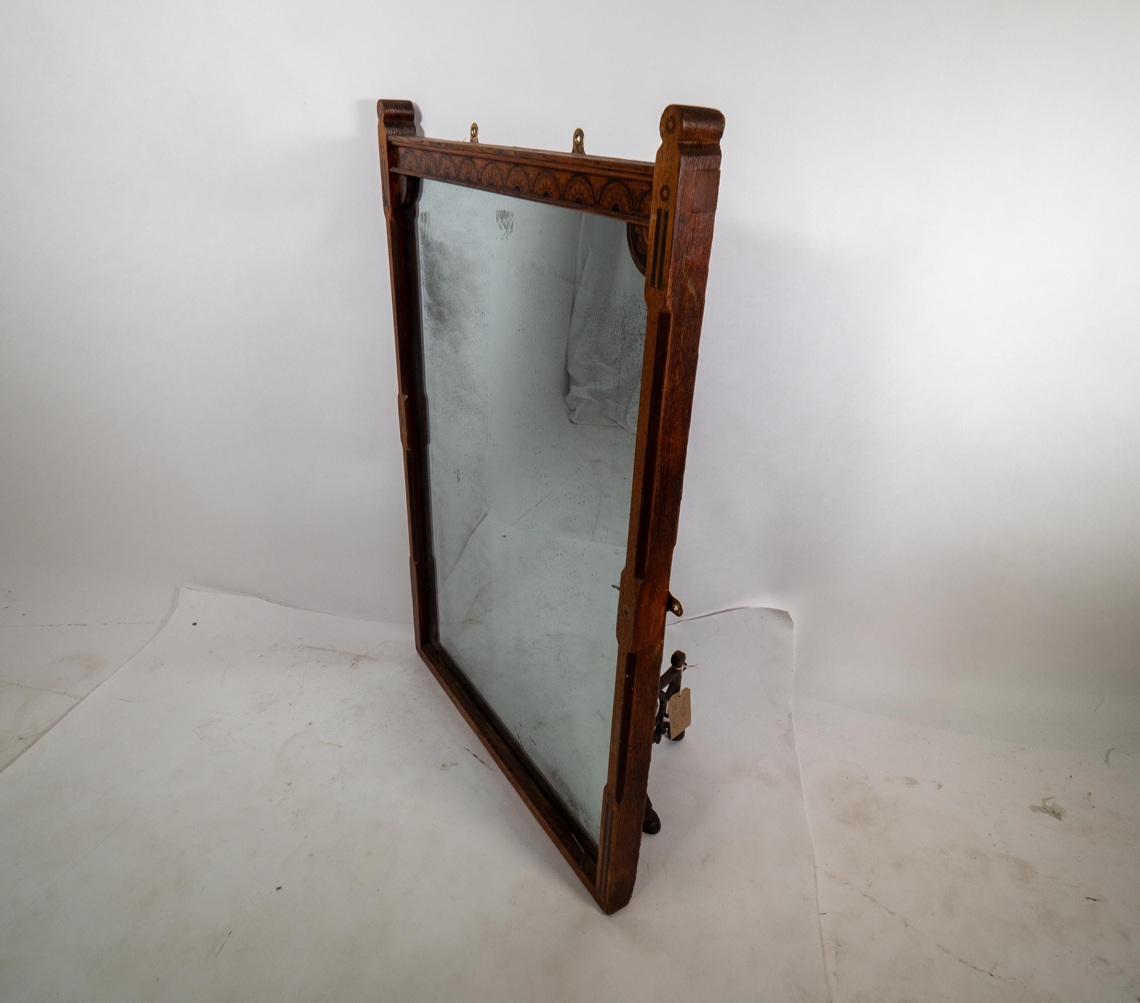 Late 19th Century A Gothic Revival oak and inlaid wall mirror with the original mercury mirror For Sale