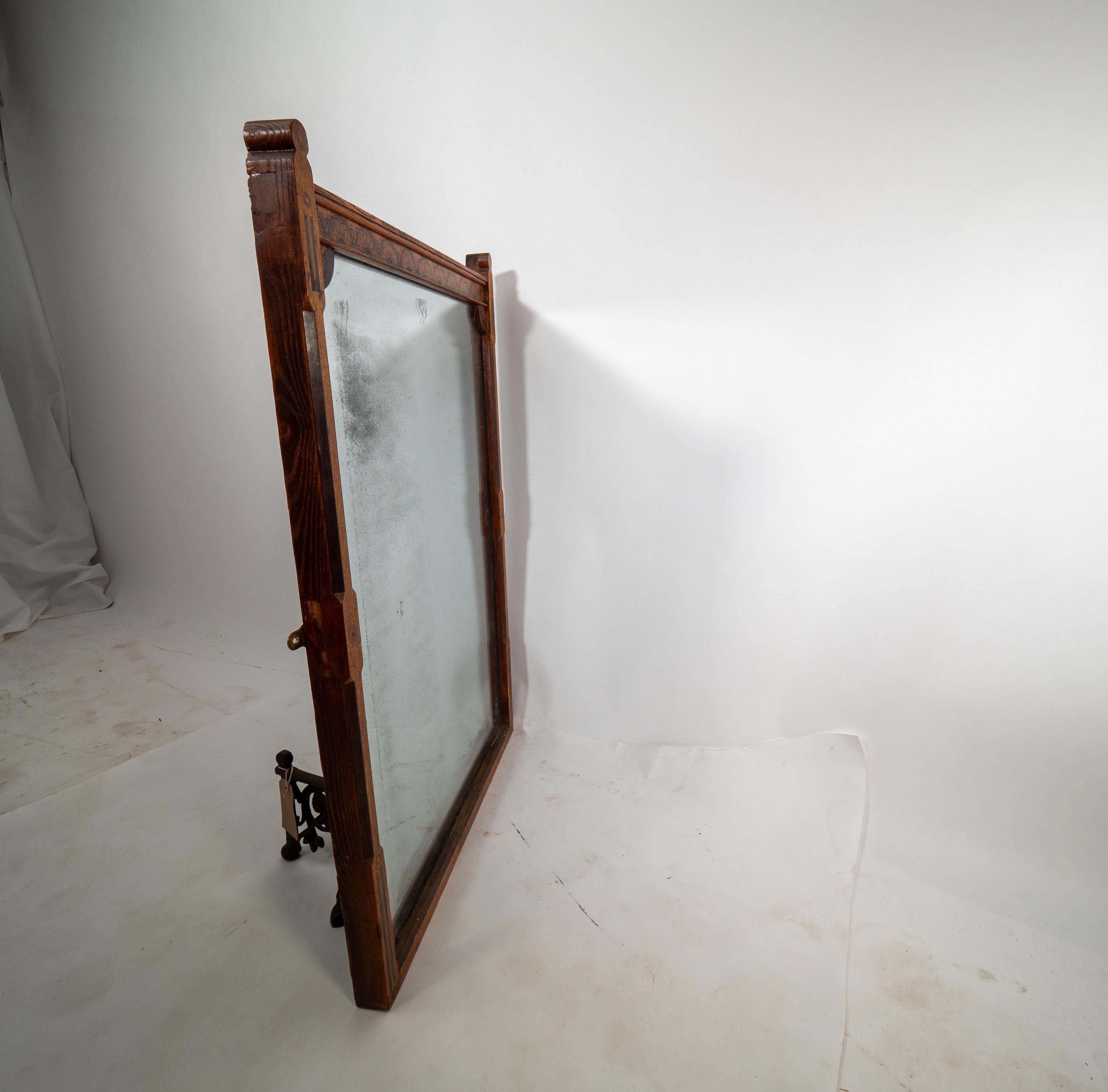 Oak A Gothic Revival oak and inlaid wall mirror with the original mercury mirror For Sale