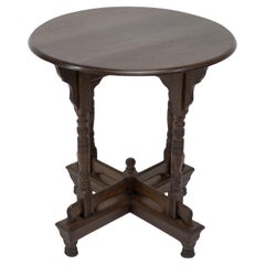 Antique Alfred Waterhouse. A Gothic Revival oak side table with double cross stretchers.