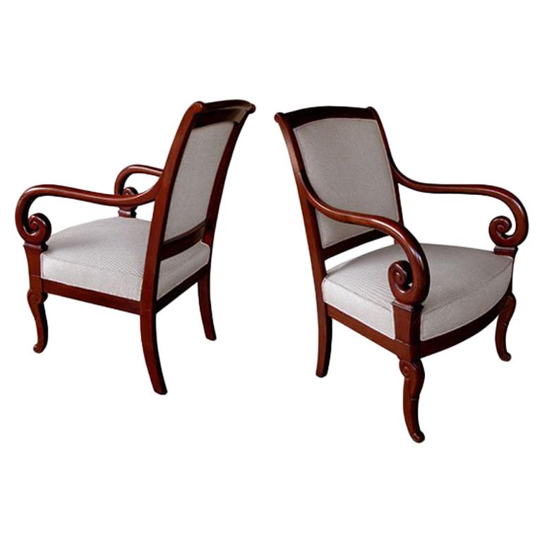 A Gracefully Proportioned Pair of French Restauration Mahogany Armchairs