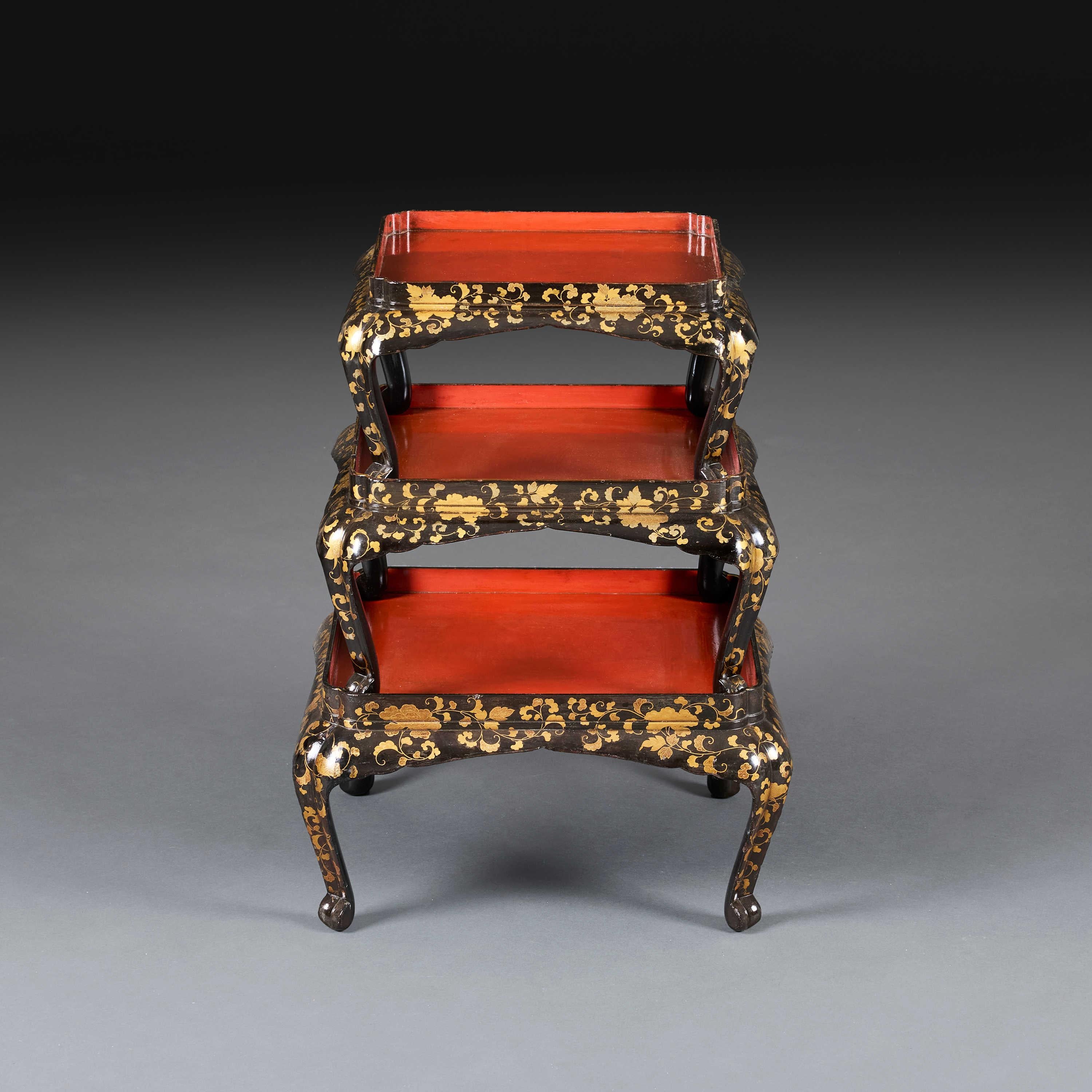 Japanese circa 1860

A late nineteenth century set of three graduated Meiji period lacquer tray tables, stacking one atop the other, with black and gold chinoiserie decoration throughout and red lacquer tops.

Total height   52.50cm.

Width         
