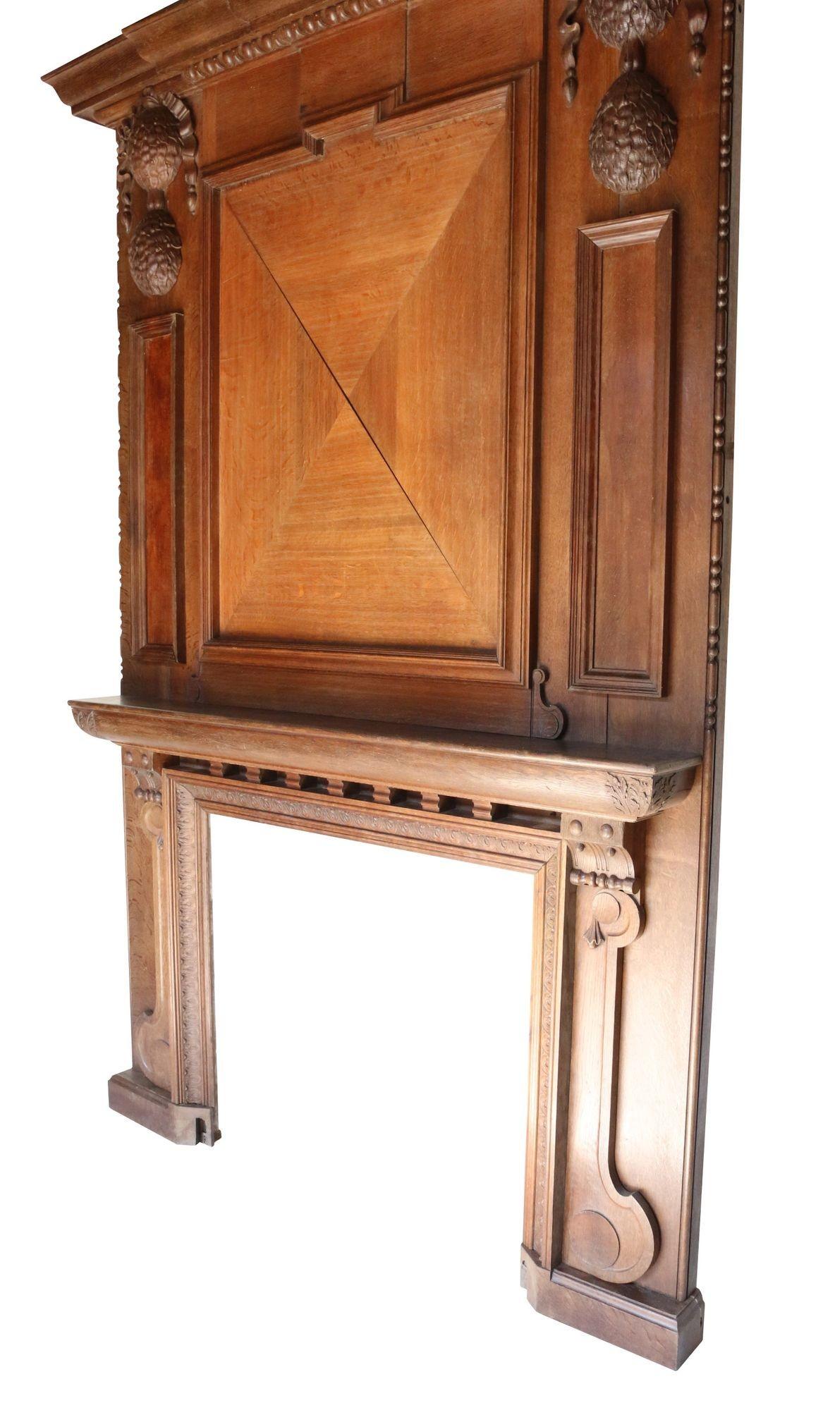 This imposing surround and over-mantle was reclaimed from a property in London during the 1950s' and has been in storage since. Constructed from English Oak

Opening Height 102.5 cm

Opening Width 114 cm

Width between outside of legs 205 cm