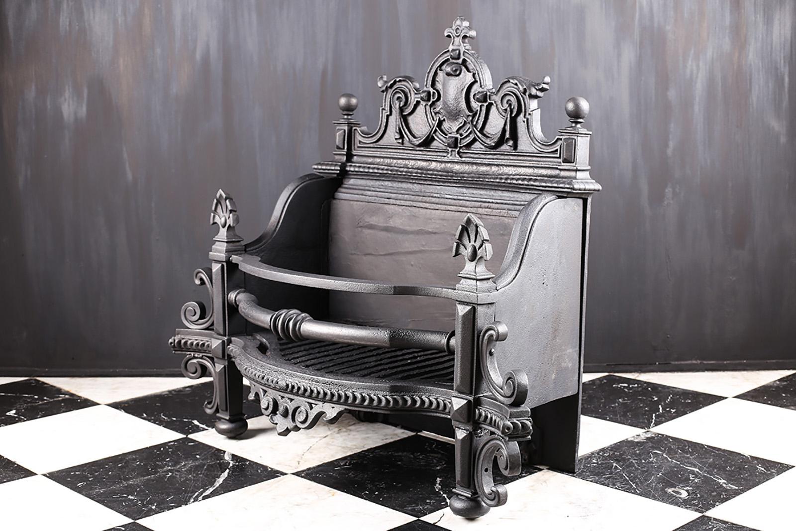 A Grand Antique Victorian in The Jacobean Revival Manner Cast Iron Log Grate, English Mid-19th Century.

Measures: Depth: 15? – 38 cm
External Height: 23? – 58.4 cm
External Width: 34? – 86.3 cm.
 